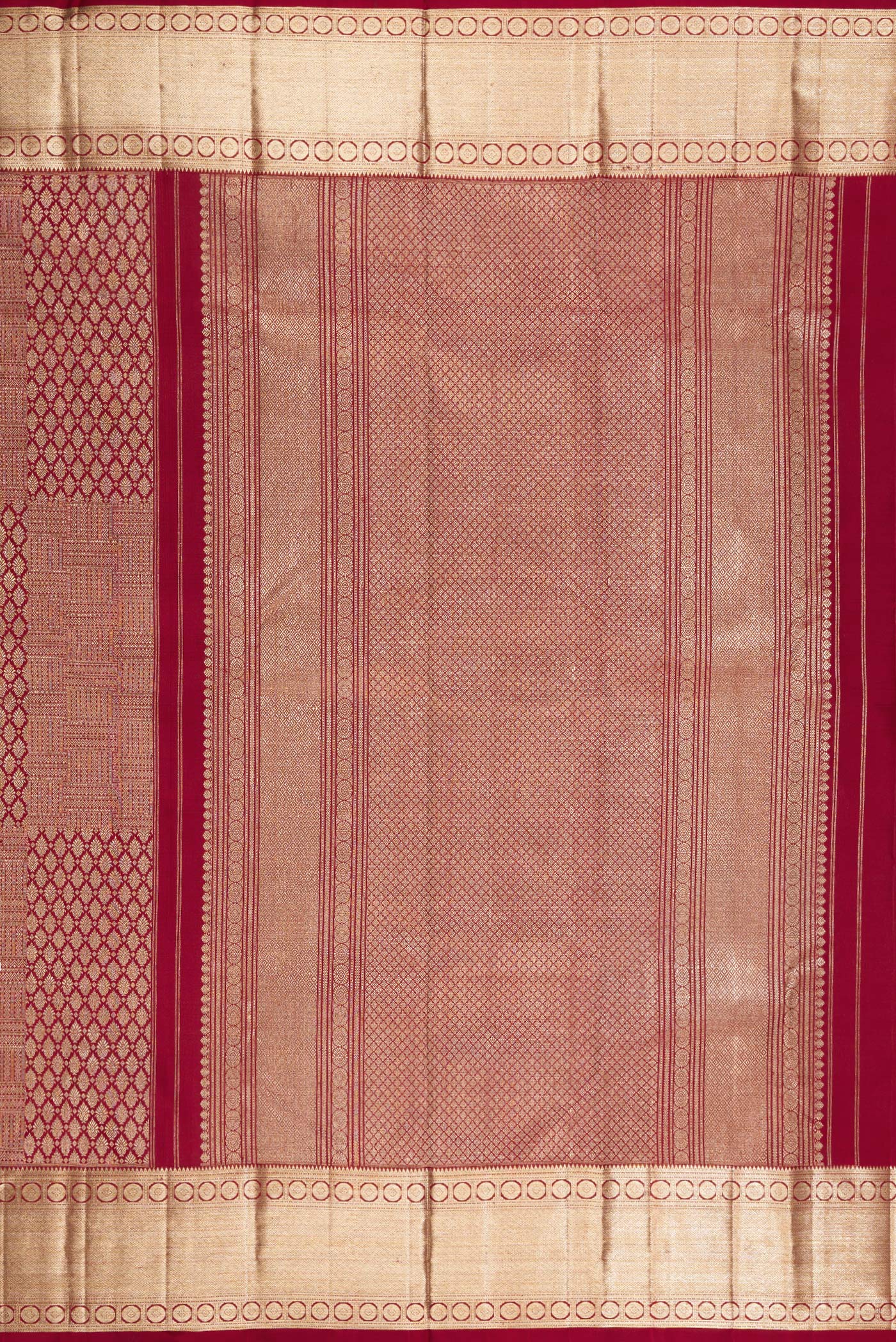 Close up image of the pallu of Maroon Kanchipuram Silk Saree with Zari Brocade on the body and Zari Border. 