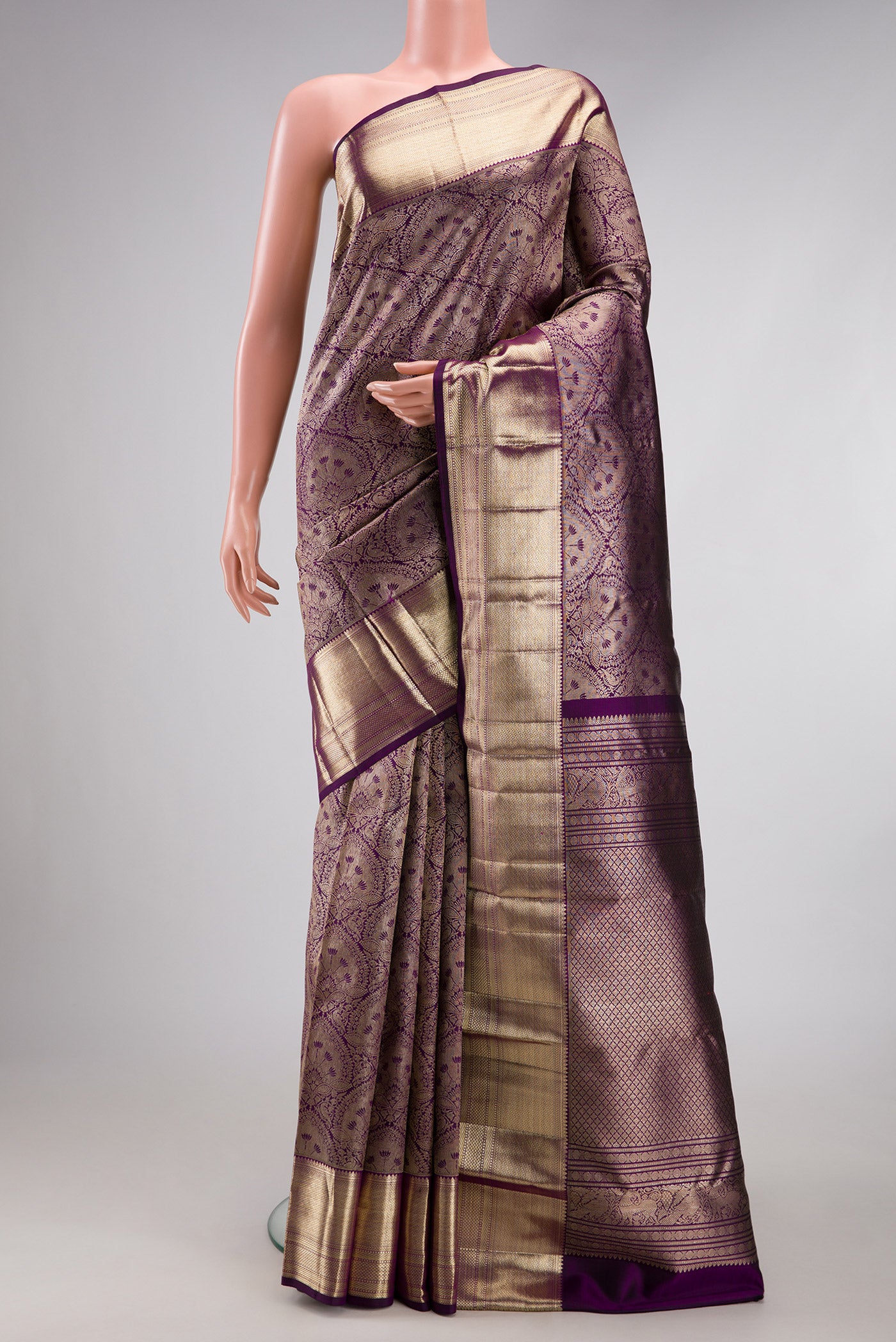 Purple Dual Tone Kanchipuram Silk Saree with Zari Brocade on the body and Zari Border.  displayed on a mannequin