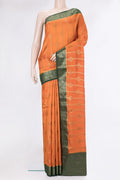 Orange Tussar Silk Saree with Zari Butta on the body and Zari Border.  displayed on a mannequin