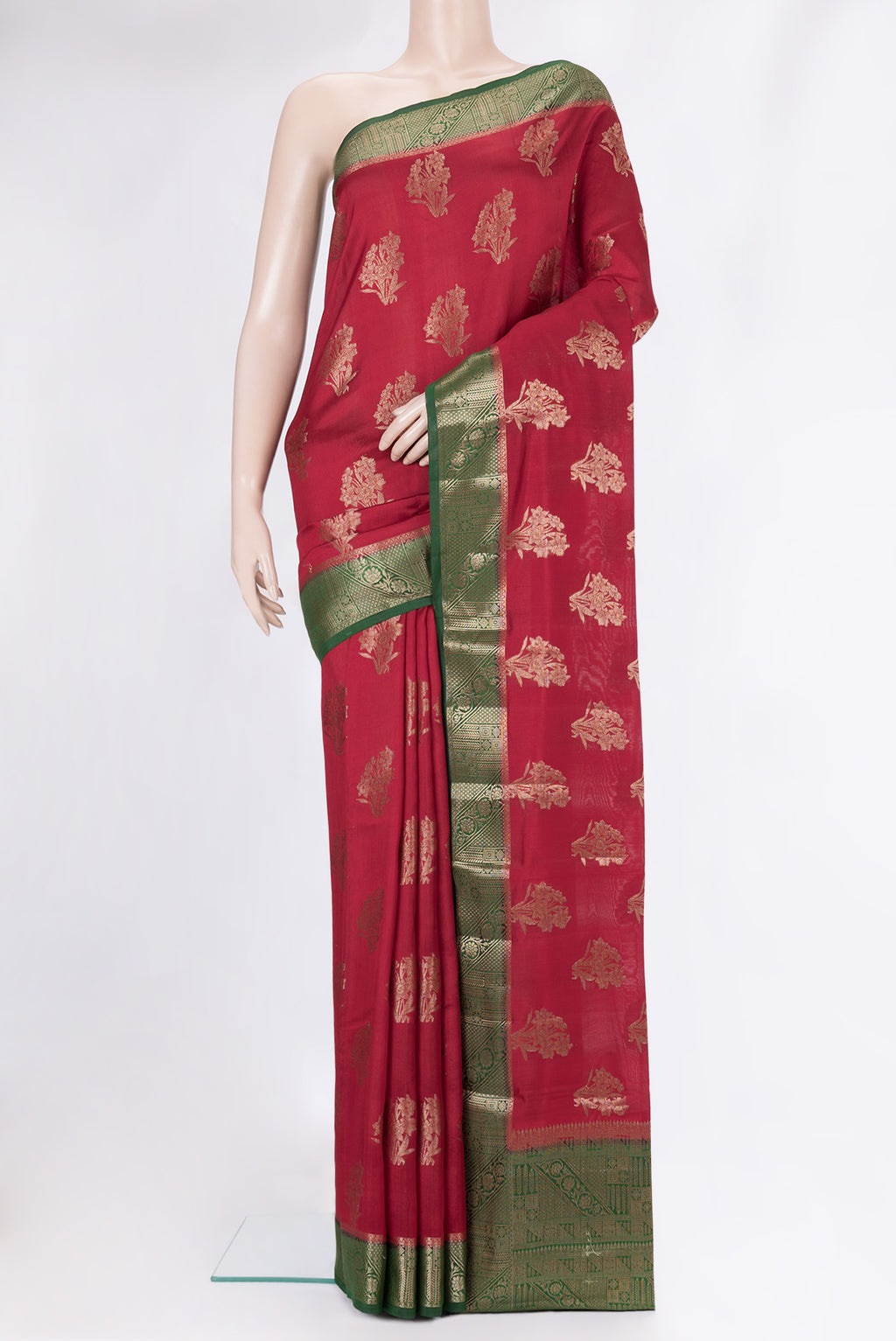 Maroon Tussar Silk Saree with Zari Butta on the body and Zari Border.  displayed on a mannequin