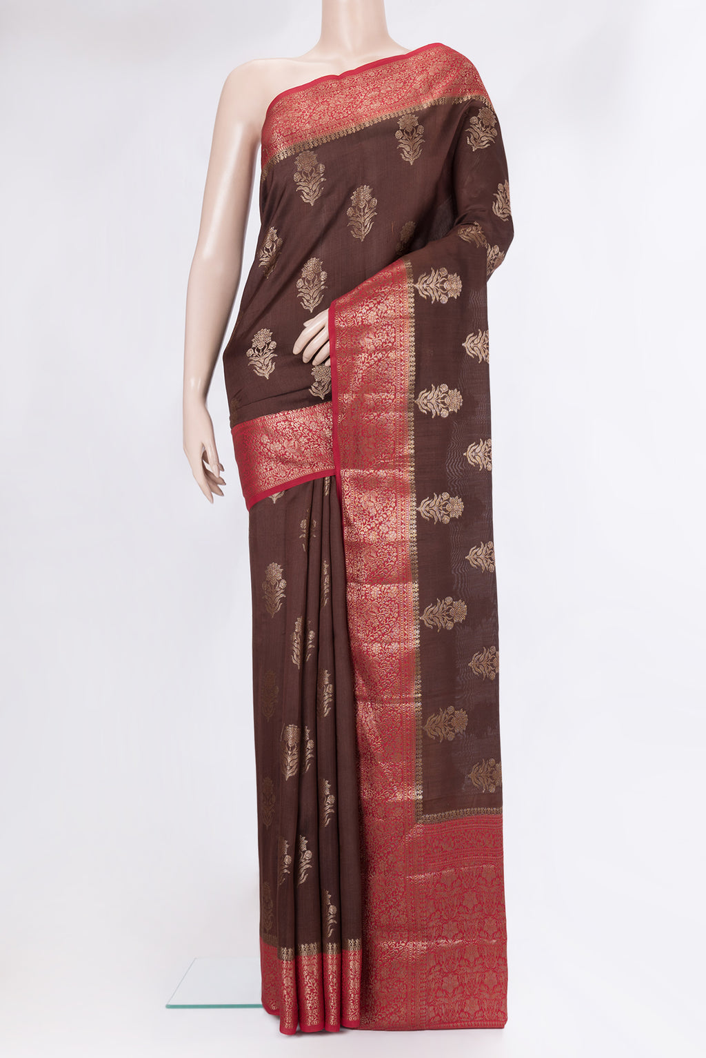 Brown Tussar Silk Saree with Zari Butta on the body and Zari Border.  displayed on a mannequin