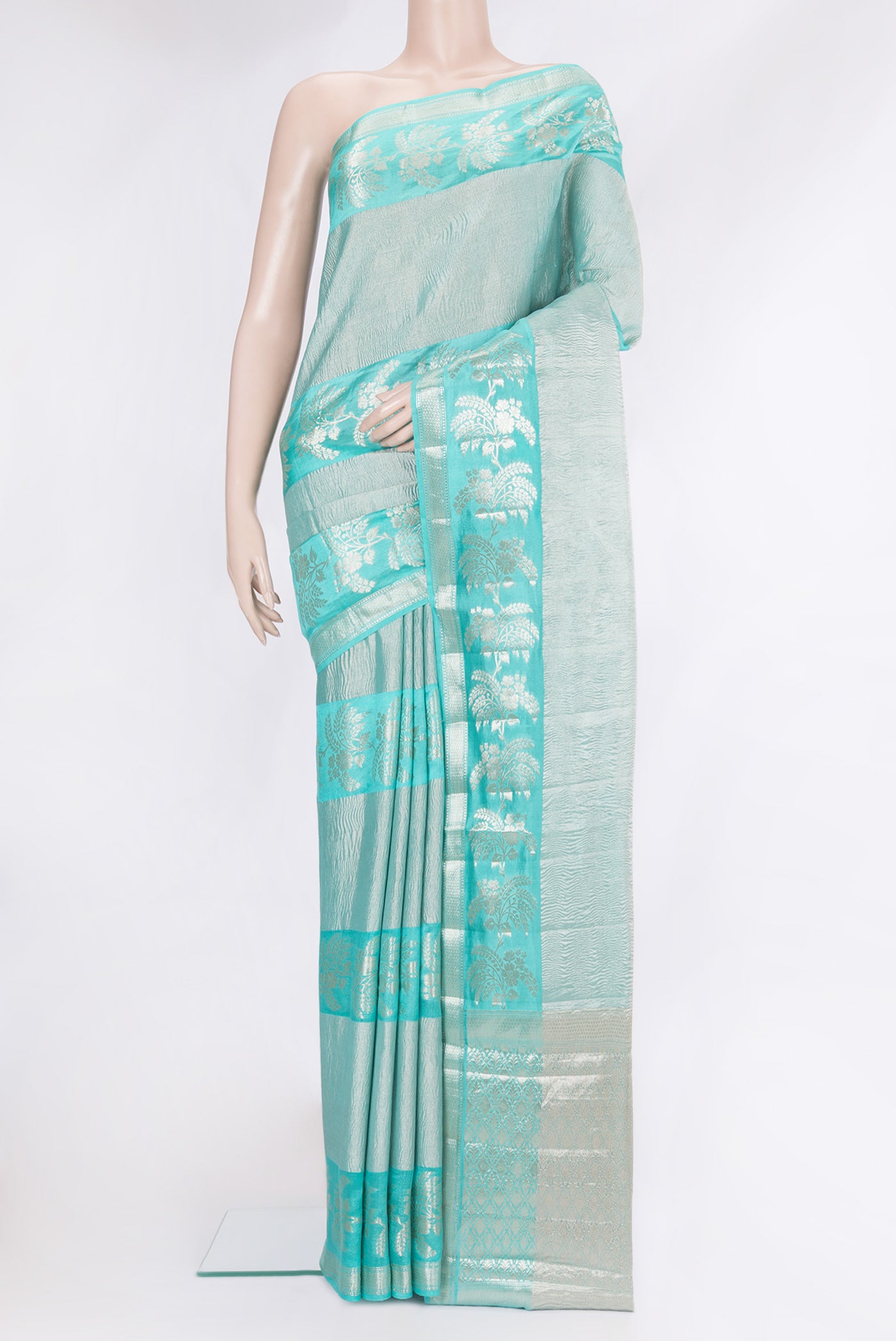 Sky Blue Tussar Silk Saree with Zari Brocade on the body and Fancy Border.  displayed on a mannequin