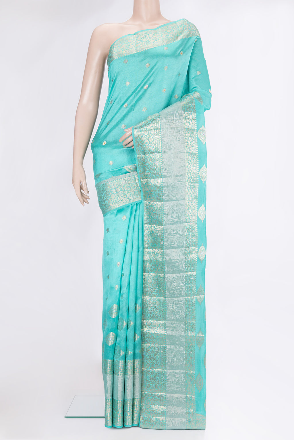 Sky Blue Tussar Silk Saree with Zari Butta on the body and Fancy Border.  displayed on a mannequin