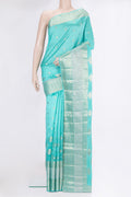 Sky Blue Tussar Silk Saree with Zari Butta on the body and Fancy Border.  displayed on a mannequin