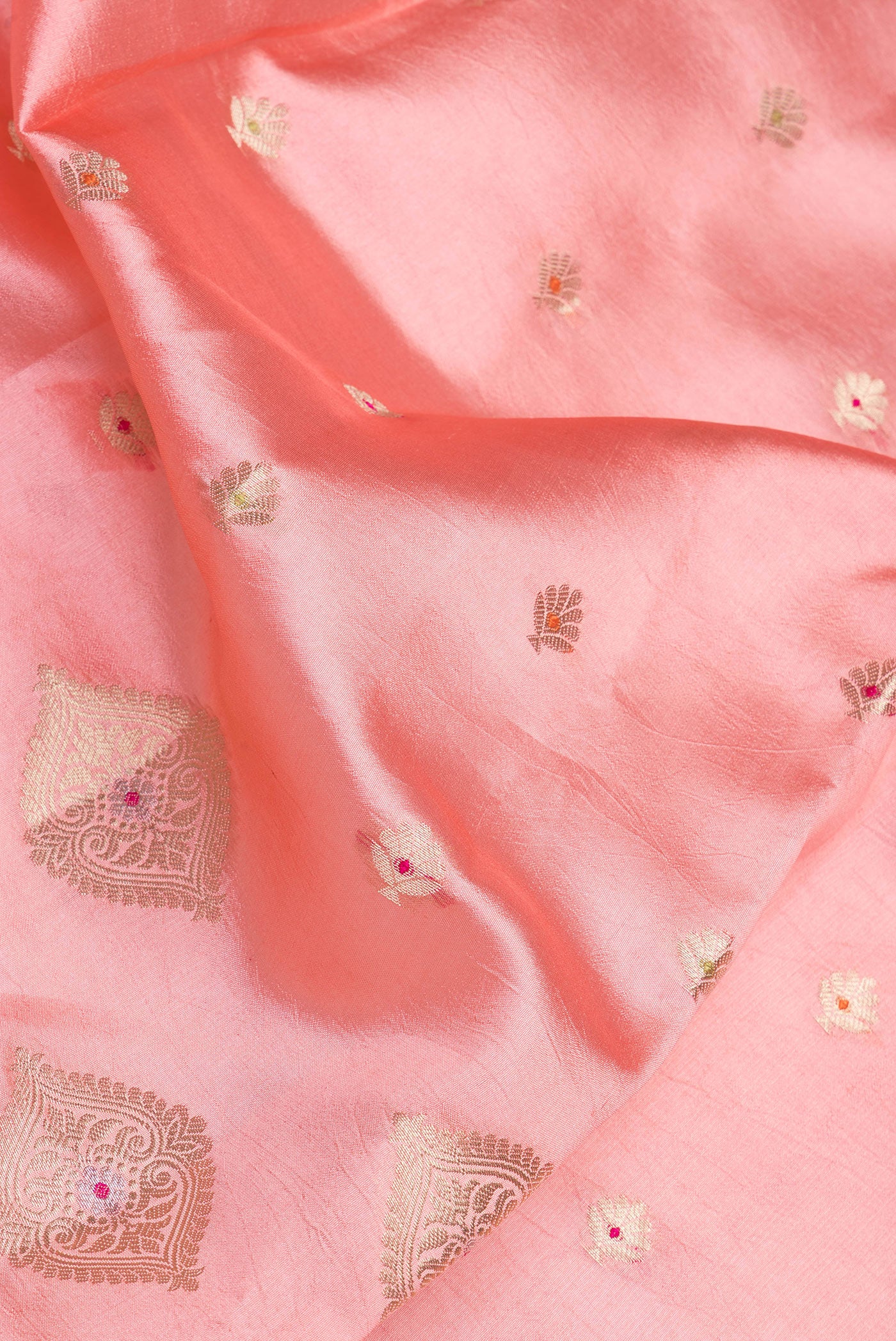 Close up of Rose pink Dual Tone Tussar Silk Saree with Zari Butta on the body and Fancy Border.  displaying folds