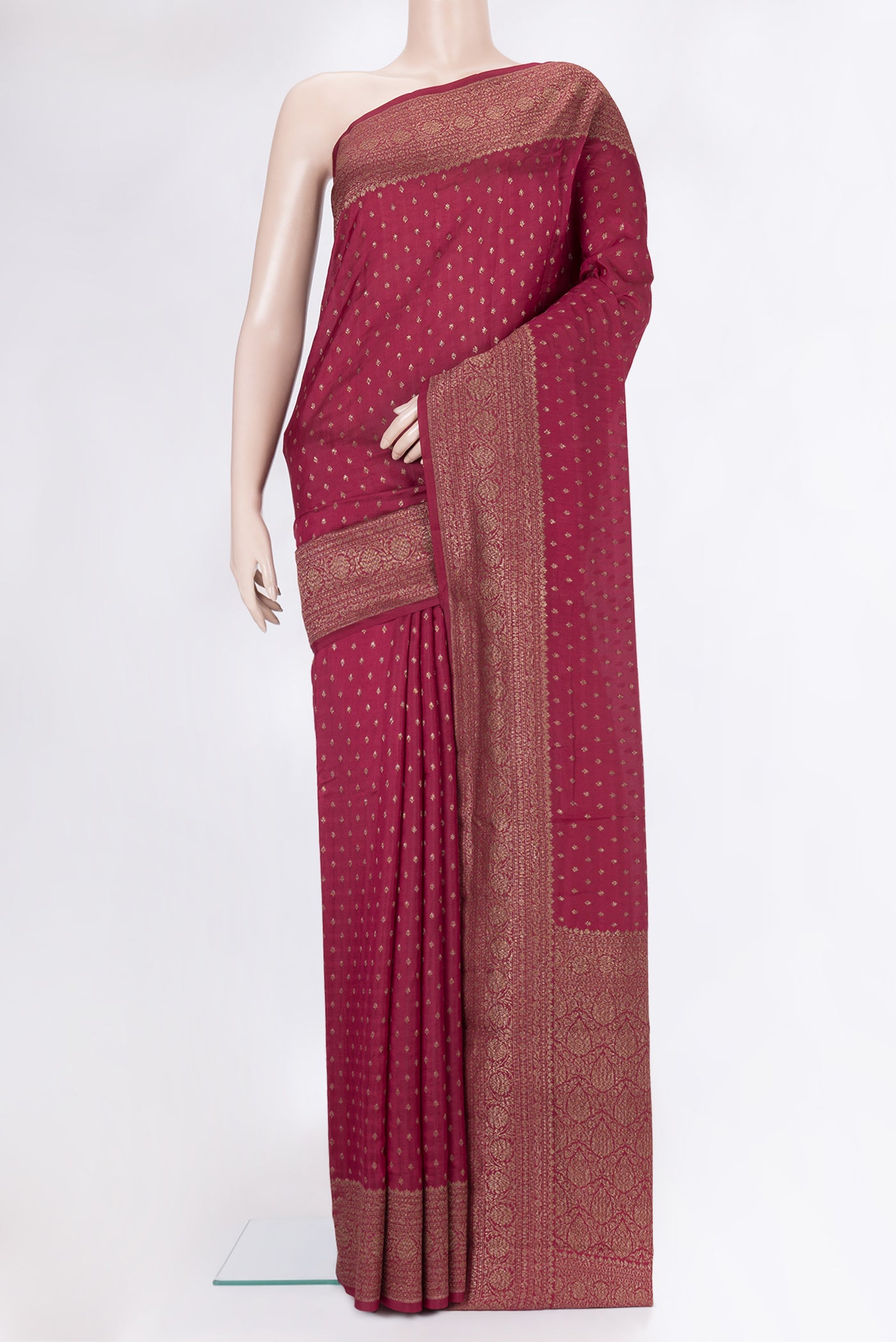 Dark Pink Tussar Silk Saree with Zari Butta on the body and Zari Border.  displayed on a mannequin