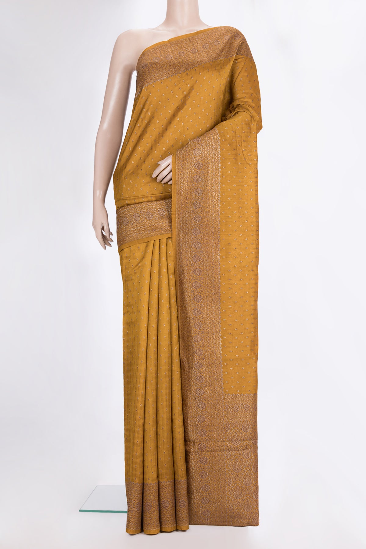 Pure Silk Mustard Tussar Saree with Zari Butta on the body and Zari Border.  displayed on a mannequin