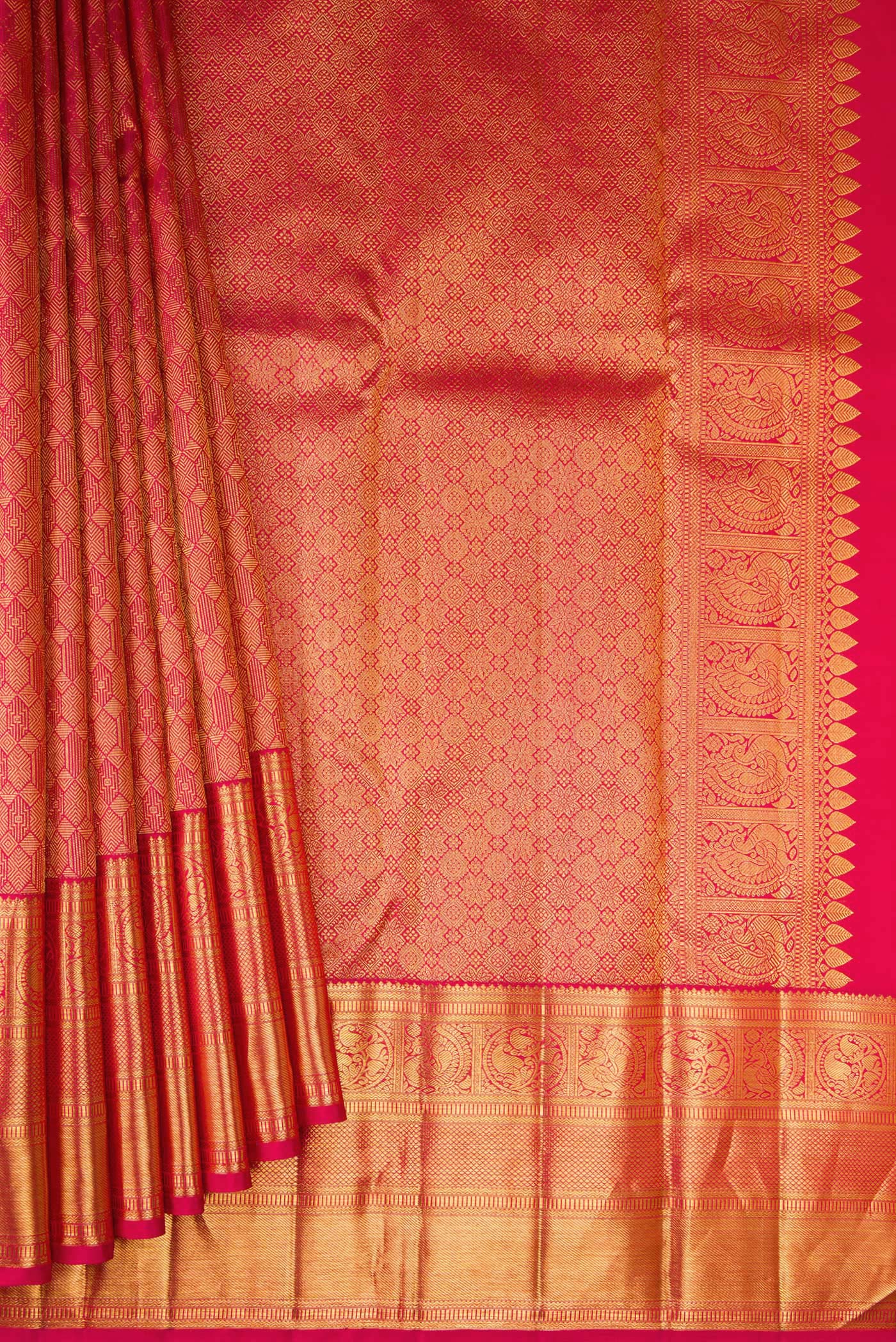 Pleats and pallu of Pink Kanchipuram Silk Saree with Zari Brocade on the body and Zari Border. 