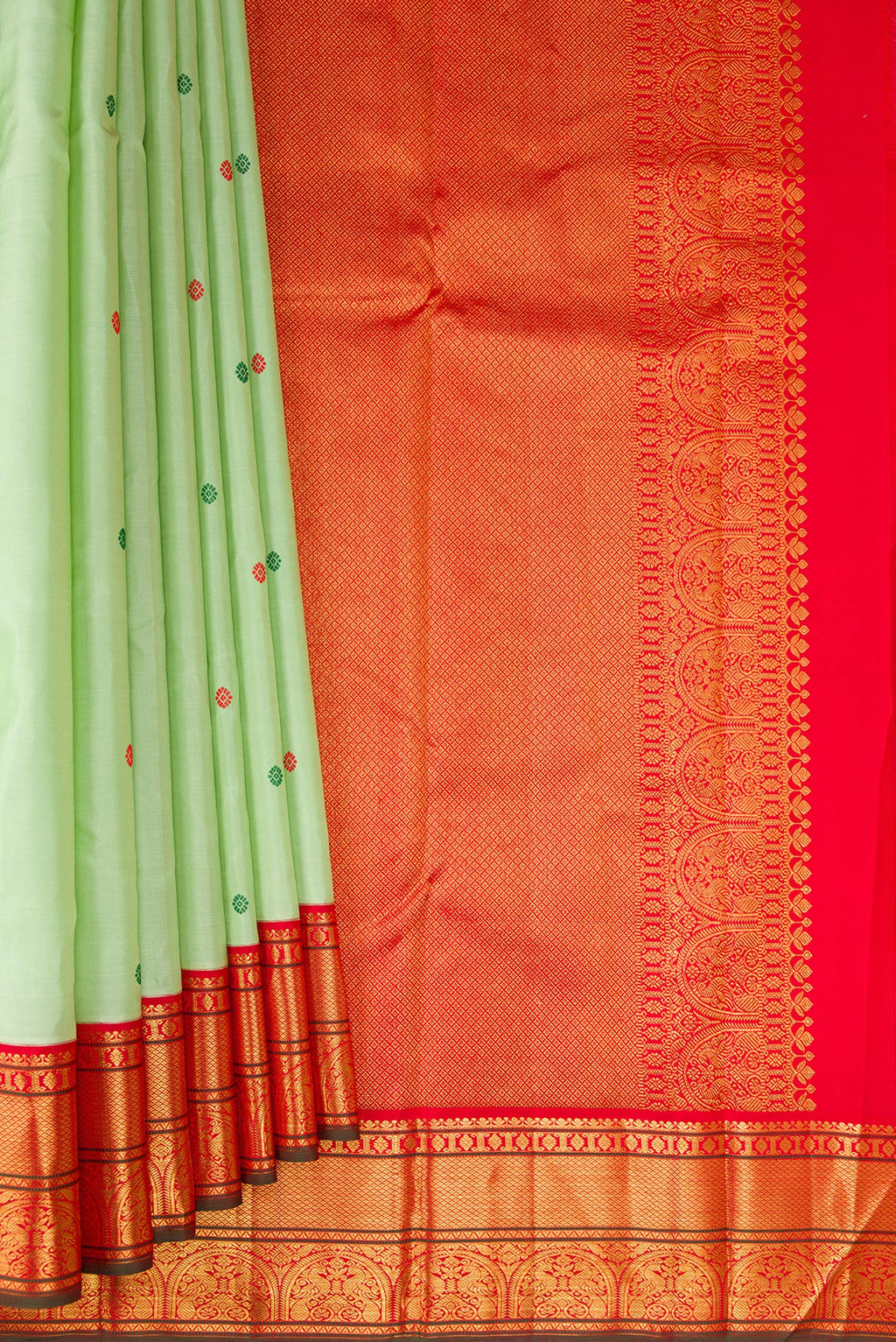 Pleats and pallu of Pure Silk Pure Zari Pista Green Dual Tone Kanchipuram Saree with Thread Butta on the body and Zari Border. 