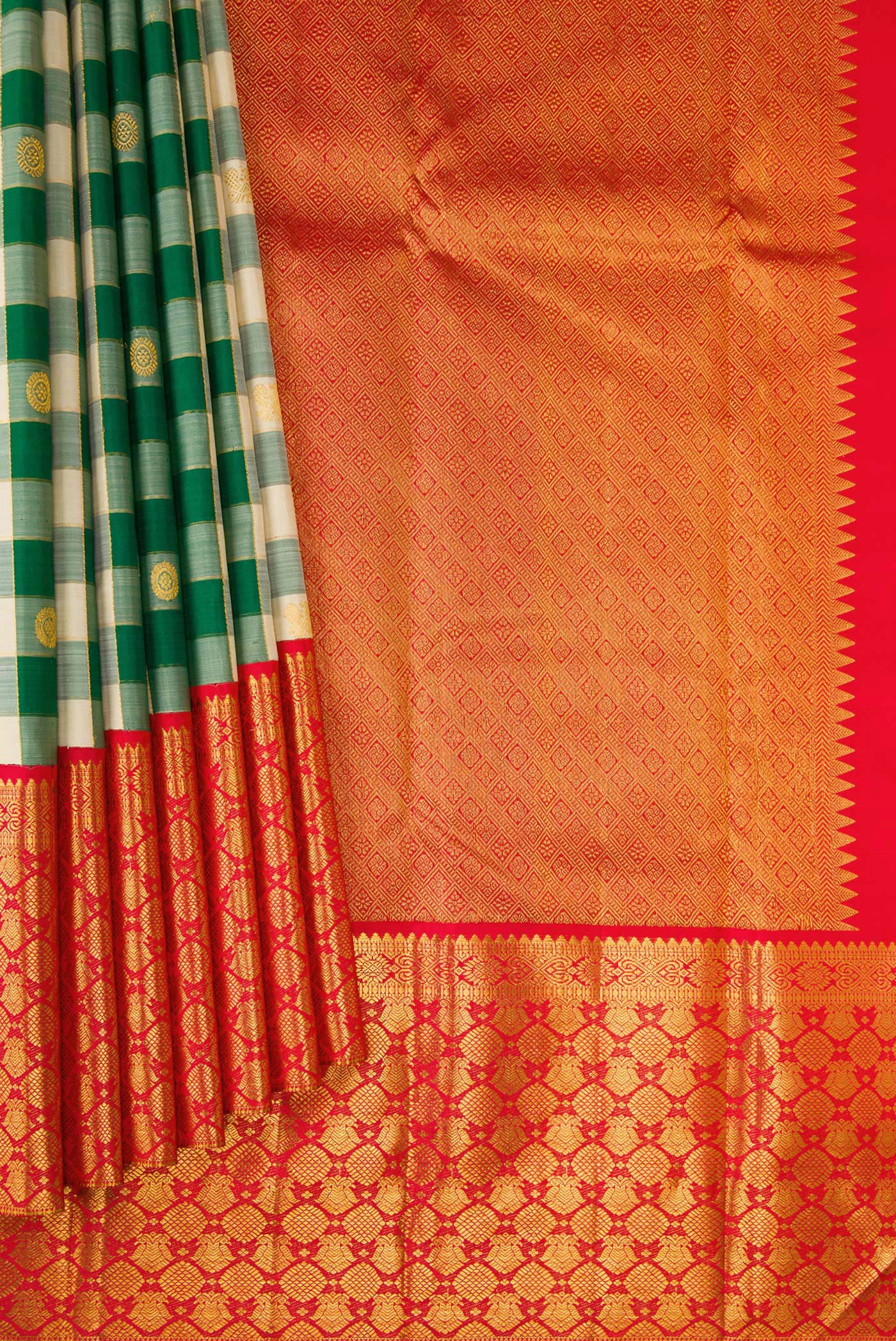 Pleats and pallu of Green Kanchipuram Silk Saree with Checked design on the body and Zari Border. 