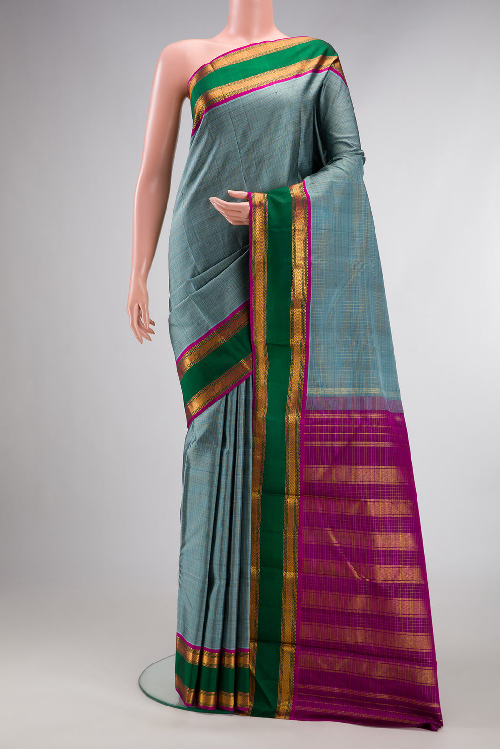 Pure Silk Grey Dual Tone Kanjivaram Saree with Checked design on the body and Zari Border.  displayed on a mannequin