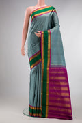 Pure Silk Grey Dual Tone Kanjivaram Saree with Checked design on the body and Zari Border.  displayed on a mannequin