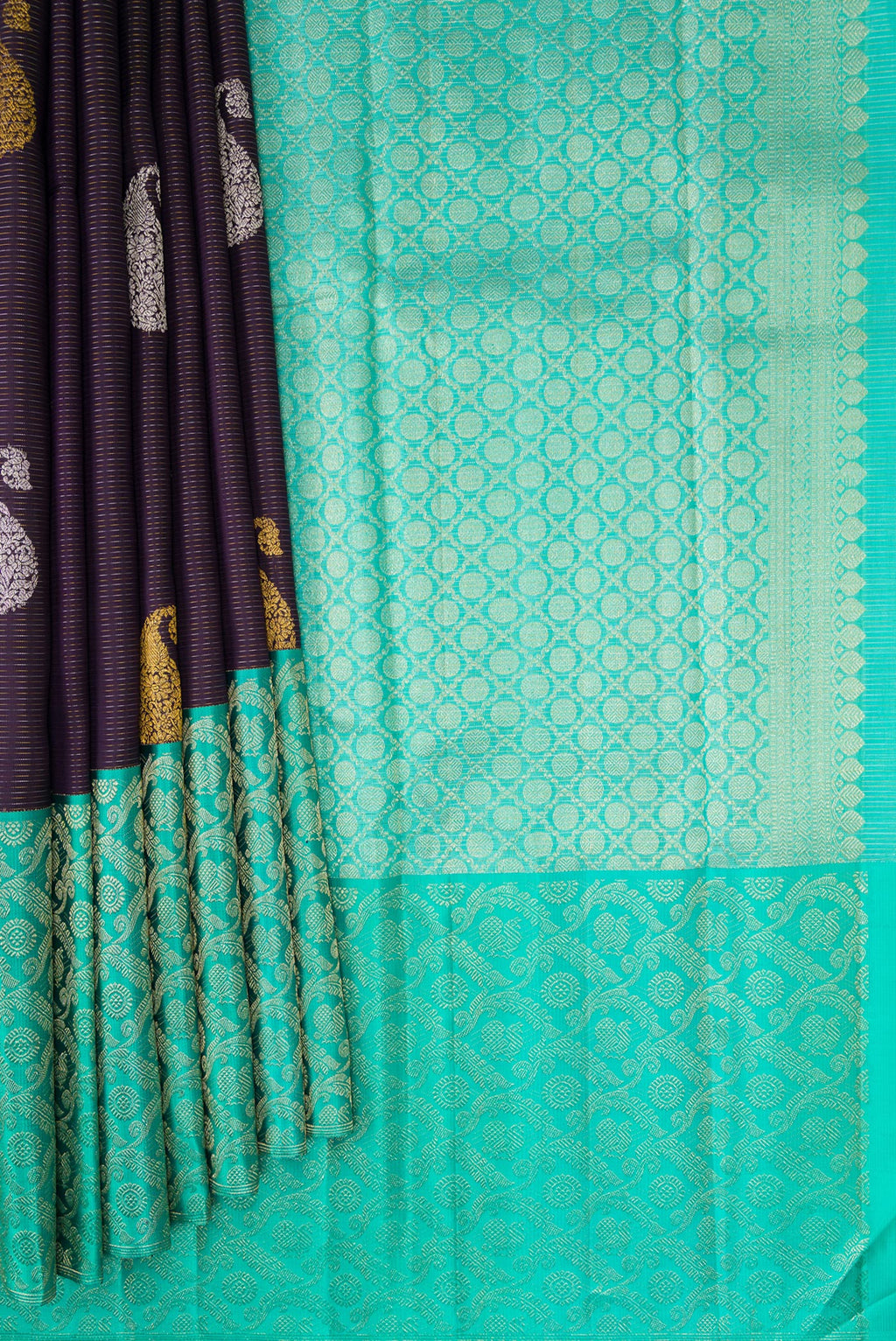 Pleats and pallu of Pure Silk Purple Kanchipuram Saree with Zari Butta on the body and Fancy Border. 