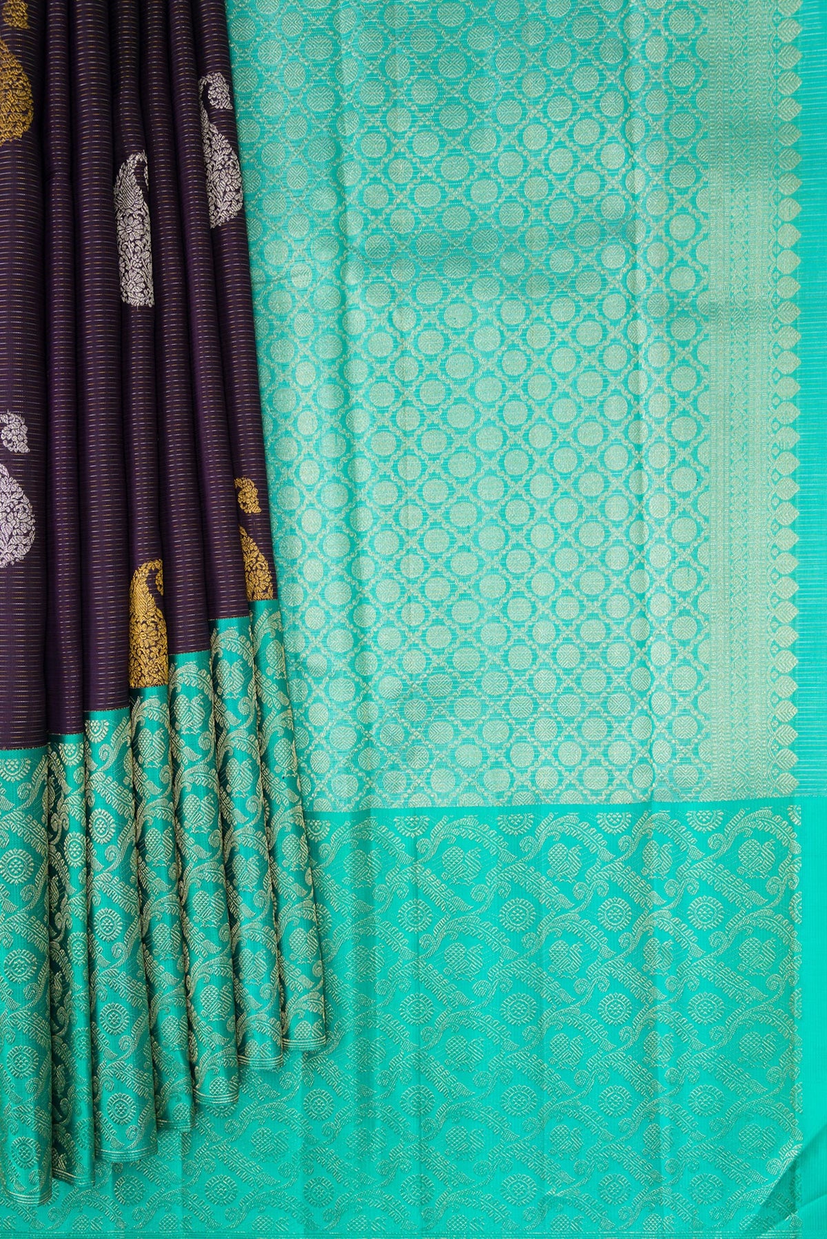Pleats and pallu of Pure Silk Purple Kanchipuram Saree with Zari Butta on the body and Fancy Border. 