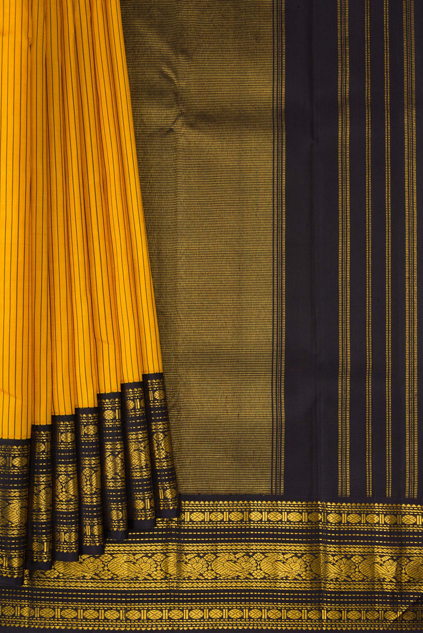 Pleats and pallu of Yellow Kanjivaram Silk Saree with Stripes on the body and Zari Border. 
