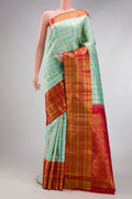 Sky Blue Kanchipuram Silk Saree with Checked design on the body and Zari Border.  displayed on a mannequin