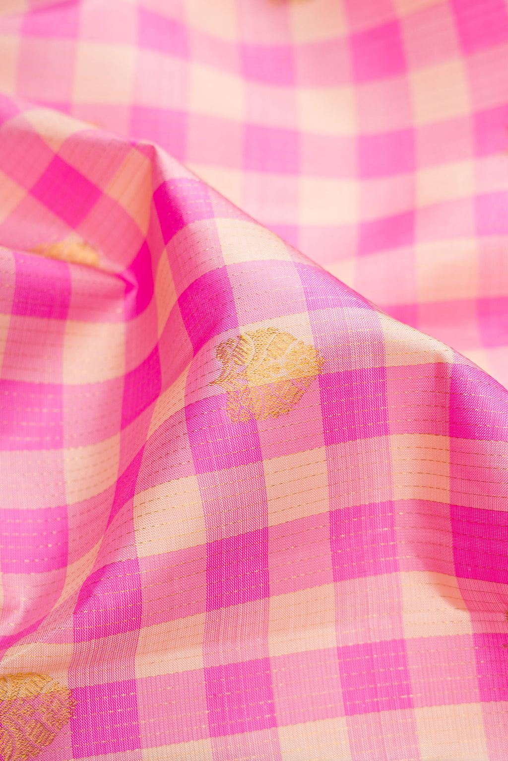 Close up of Multi Color Kanchipuram Silk Saree with Checked design on the body and Fancy Border.  displaying folds