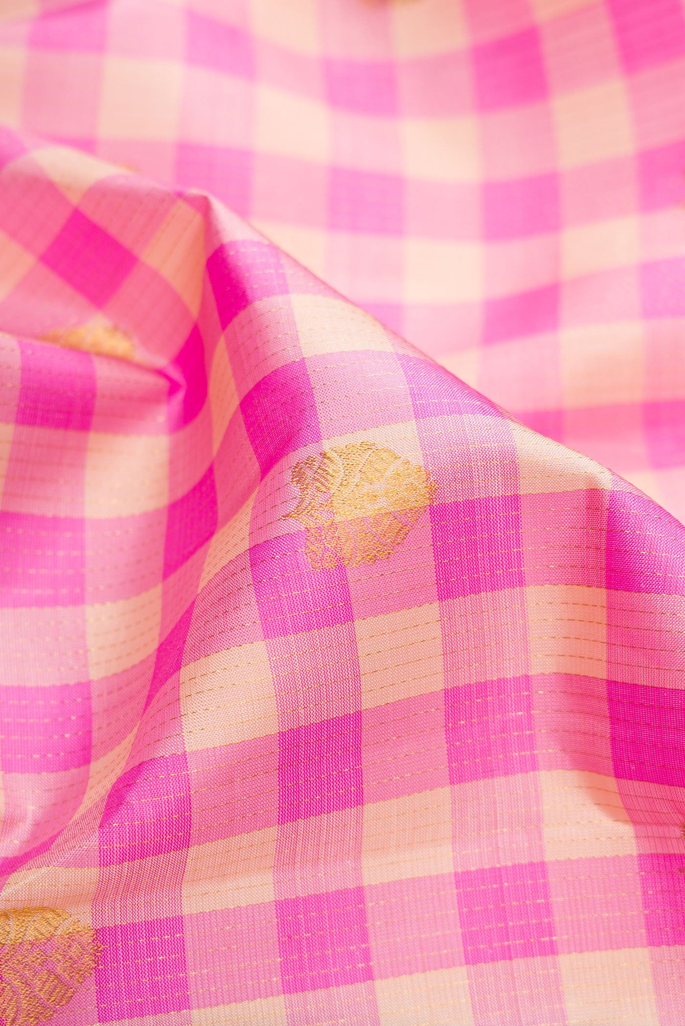Close up of Multi Color Kanchipuram Silk Saree with Checked design on the body and Fancy Border.  displaying folds