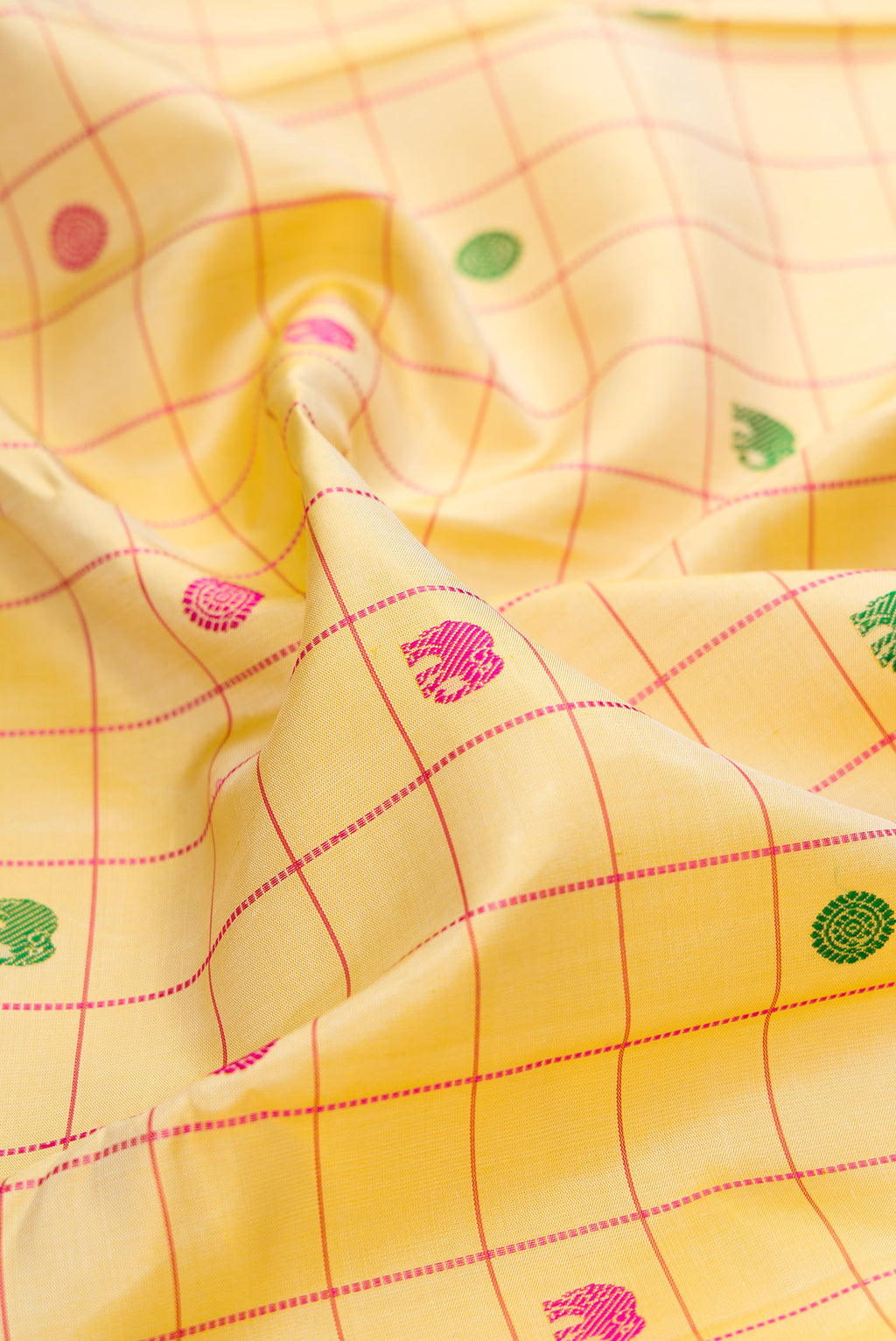 Close up of Pure Silk Pure Zari Sandal Dual Tone Kanjivaram Saree with Checked design on the body and Zari Border.  displaying folds