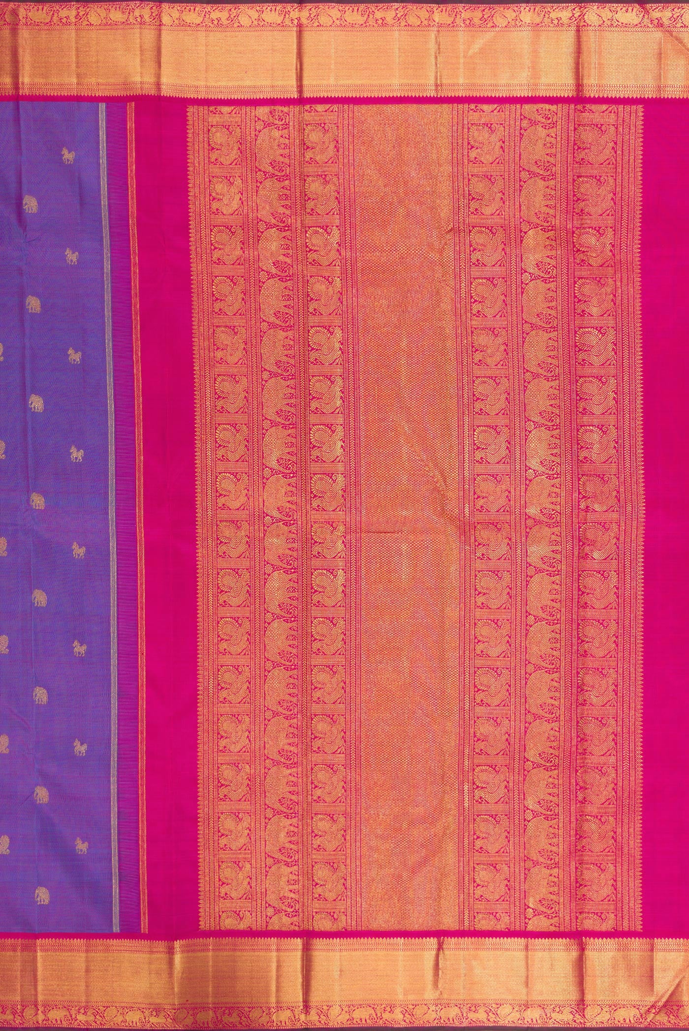 Close up image of the pallu of Purple Dual Tone Kanchipuram Silk Saree with Zari Butta on the body and Zari Border. 