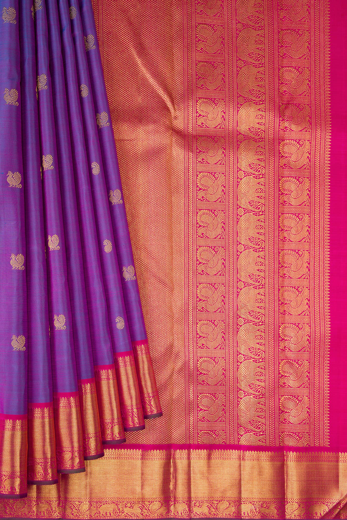 Pleats and pallu of Purple Dual Tone Kanchipuram Silk Saree with Zari Butta on the body and Zari Border. 