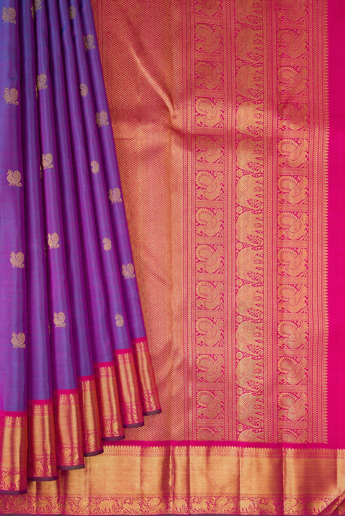 Pleats and pallu of Purple Dual Tone Kanchipuram Silk Saree with Zari Butta on the body and Zari Border. 