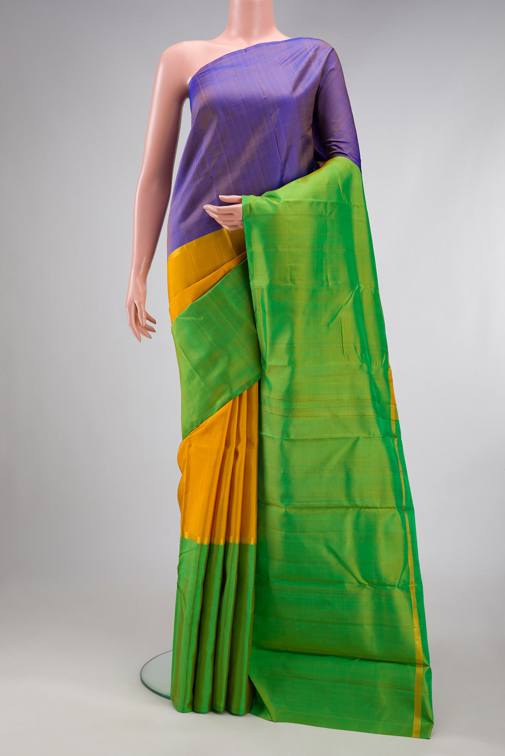 Yellow Kanjivaram Silk Saree with Plain Body and Without Border.  displayed on a mannequin