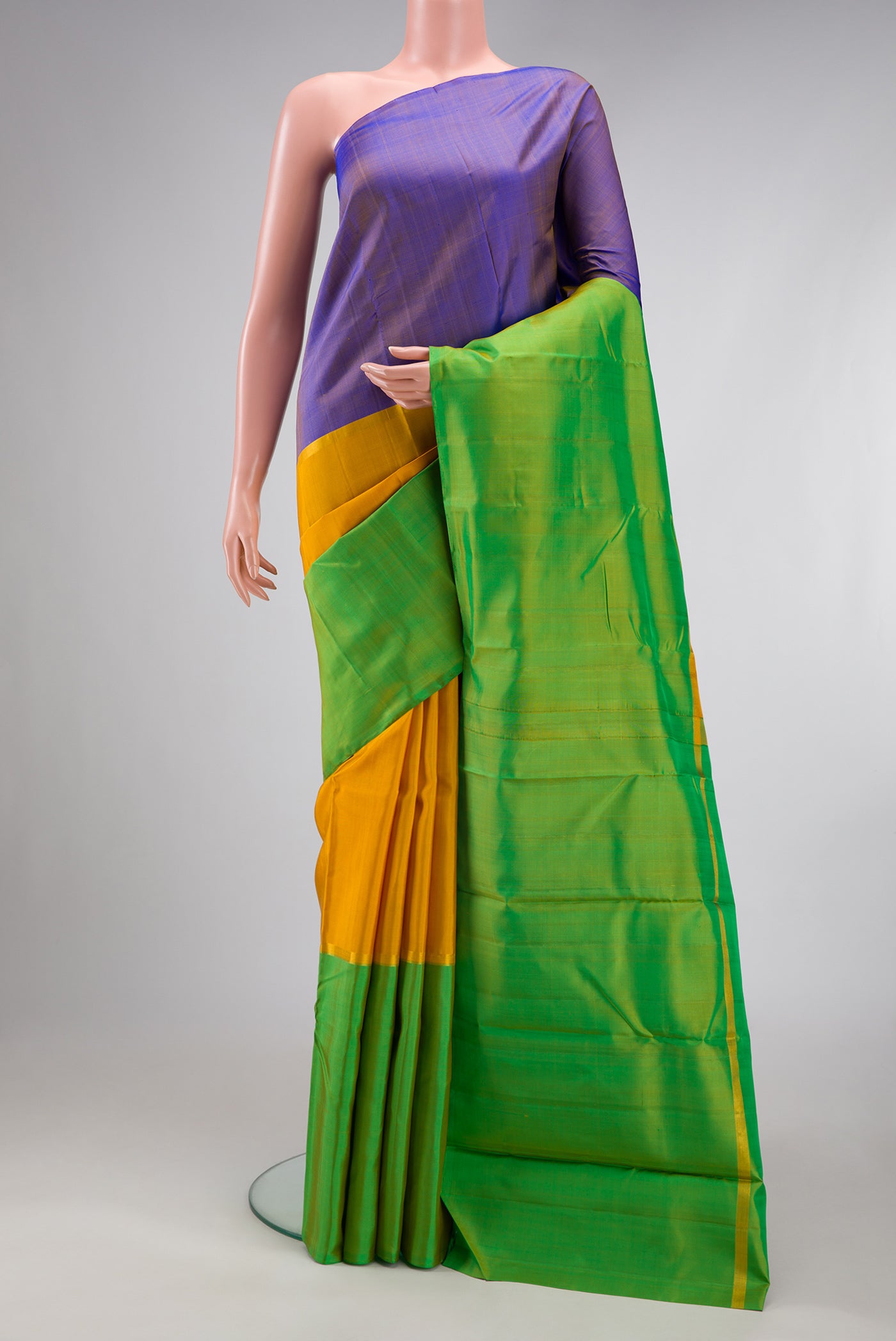 Yellow Kanjivaram Silk Saree with Plain Body and Without Border.  displayed on a mannequin