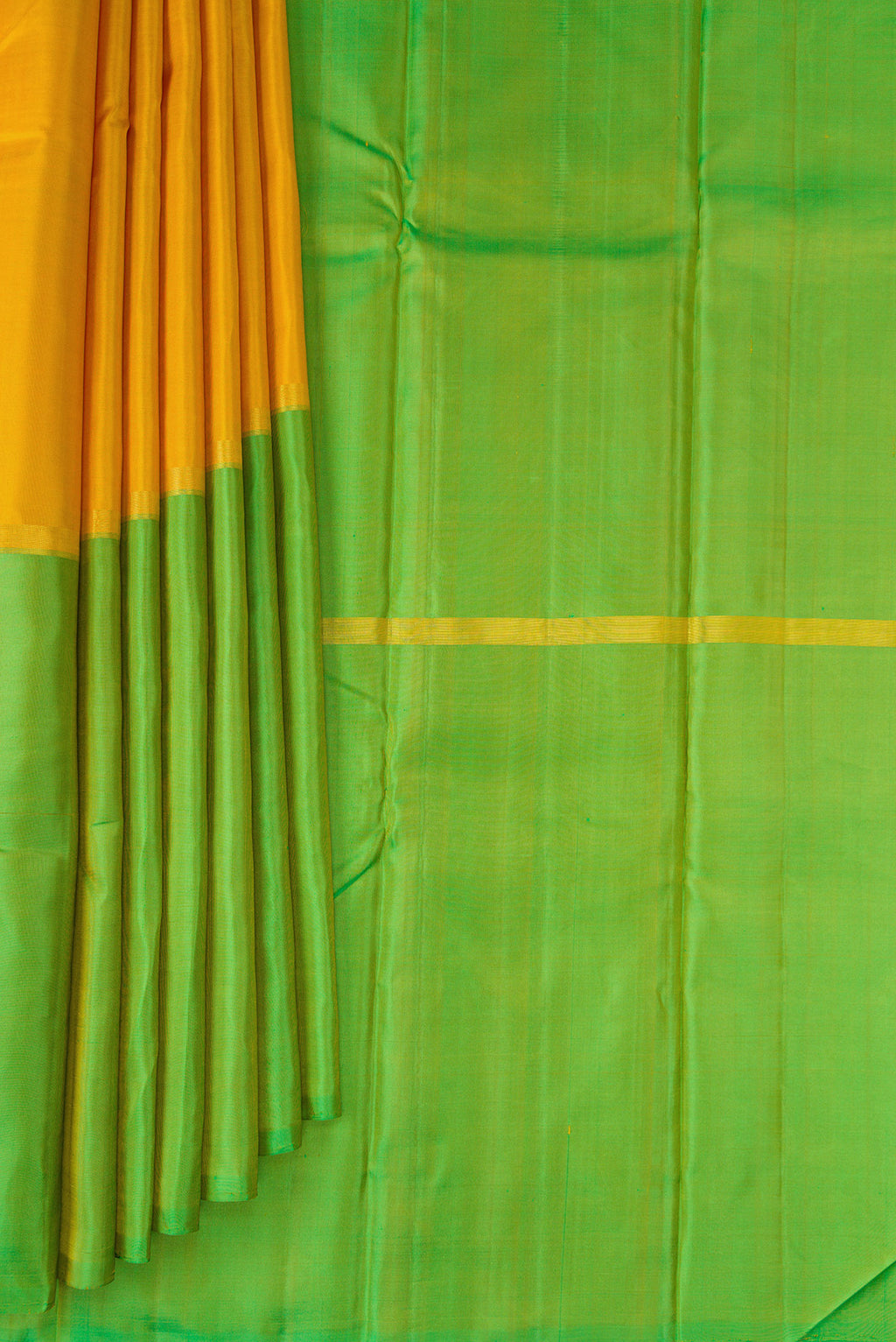 Pleats and pallu of Yellow Kanjivaram Silk Saree with Plain Body and Without Border. 