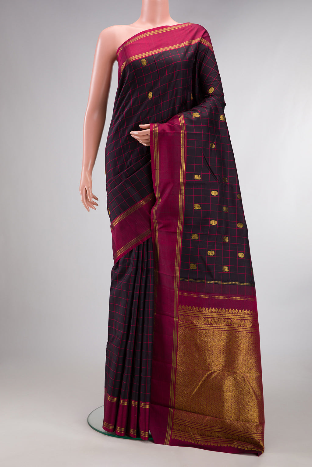 Pure Silk Brown Kanjivaram Saree with Checked design on the body and Plain Border.  displayed on a mannequin