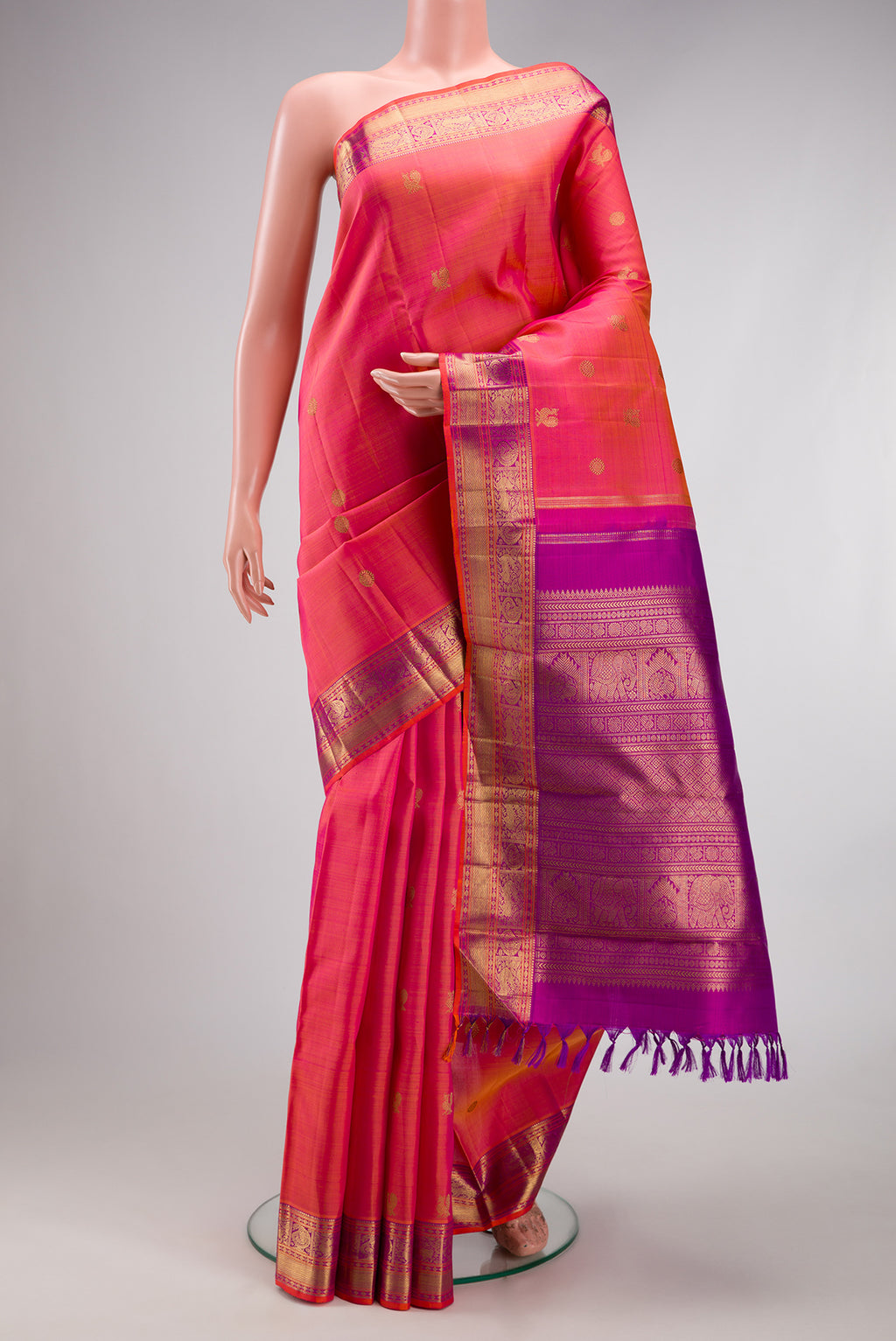 Pure Silk Pure Zari Pink Dual Tone Kanjivaram Saree with Zari Butta on the body and Zari Border.  displayed on a mannequin