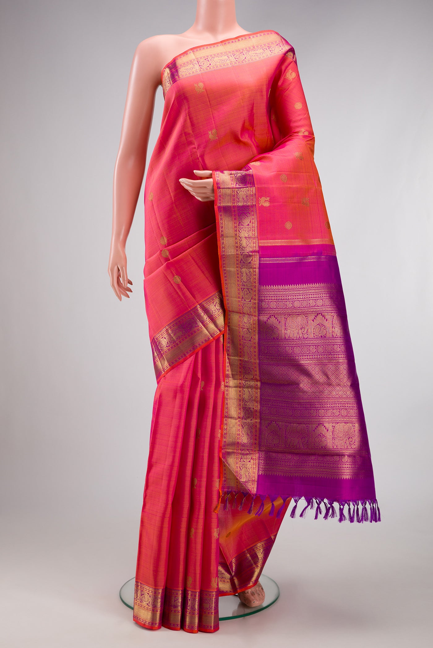 Pure Silk Pure Zari Pink Dual Tone Kanjivaram Saree with Zari Butta on the body and Zari Border.  displayed on a mannequin