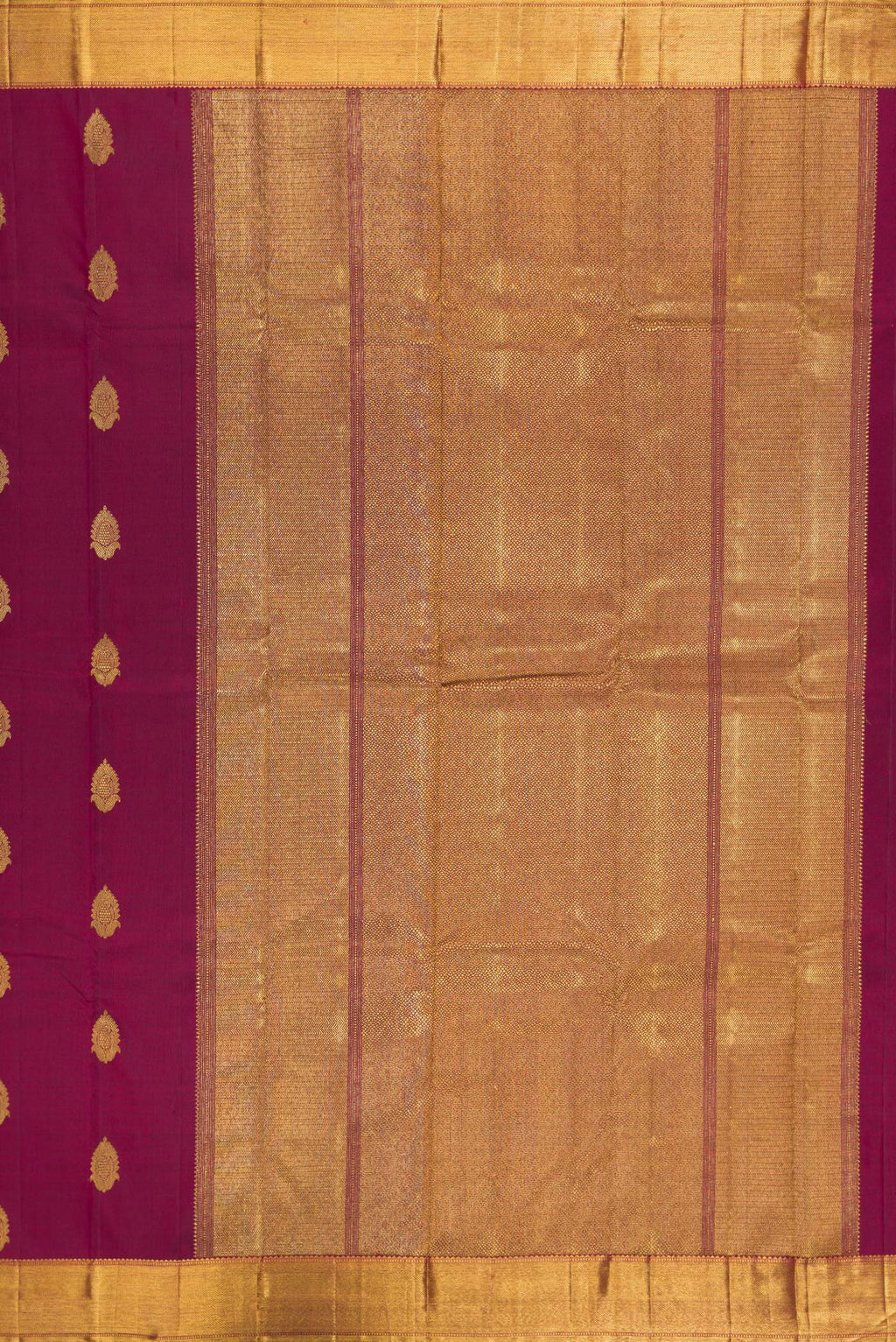 Close up image of the pallu of Pure Silk Pure Zari Maroon Kanjivaram Saree with Zari Butta on the body and Zari Border. 