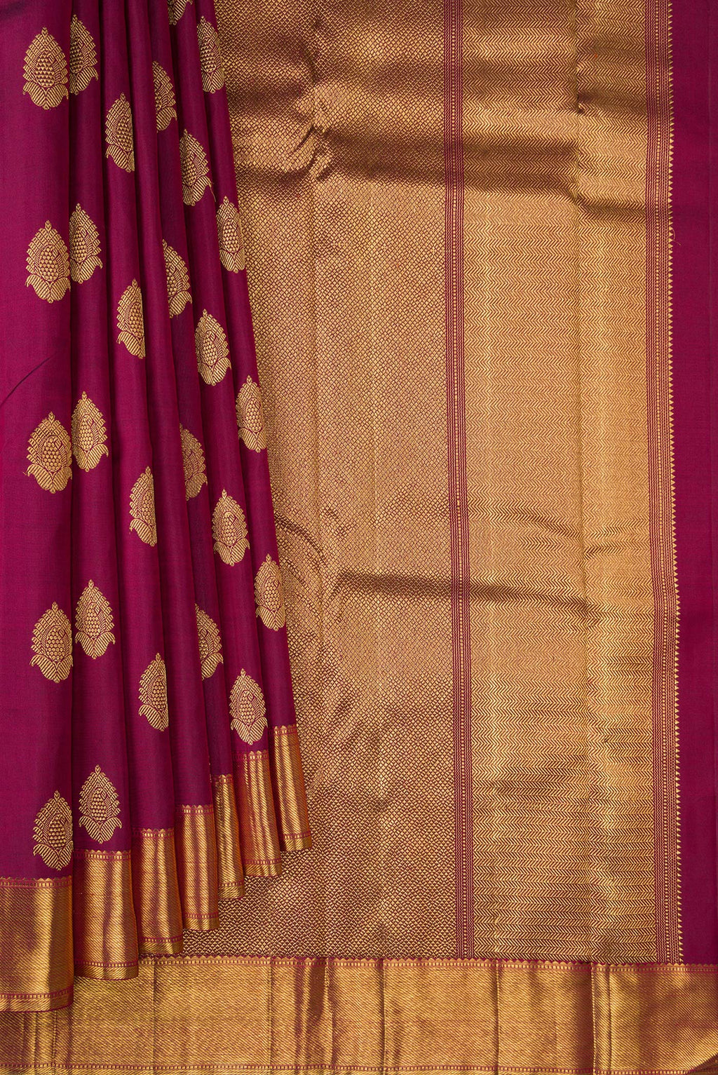 Pleats and pallu of Pure Silk Pure Zari Maroon Kanjivaram Saree with Zari Butta on the body and Zari Border. 