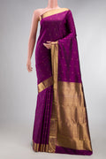 Pure Silk Pure Zari Purple Kanjivaram Saree with Zari Butta on the body and Zari Border.  displayed on a mannequin