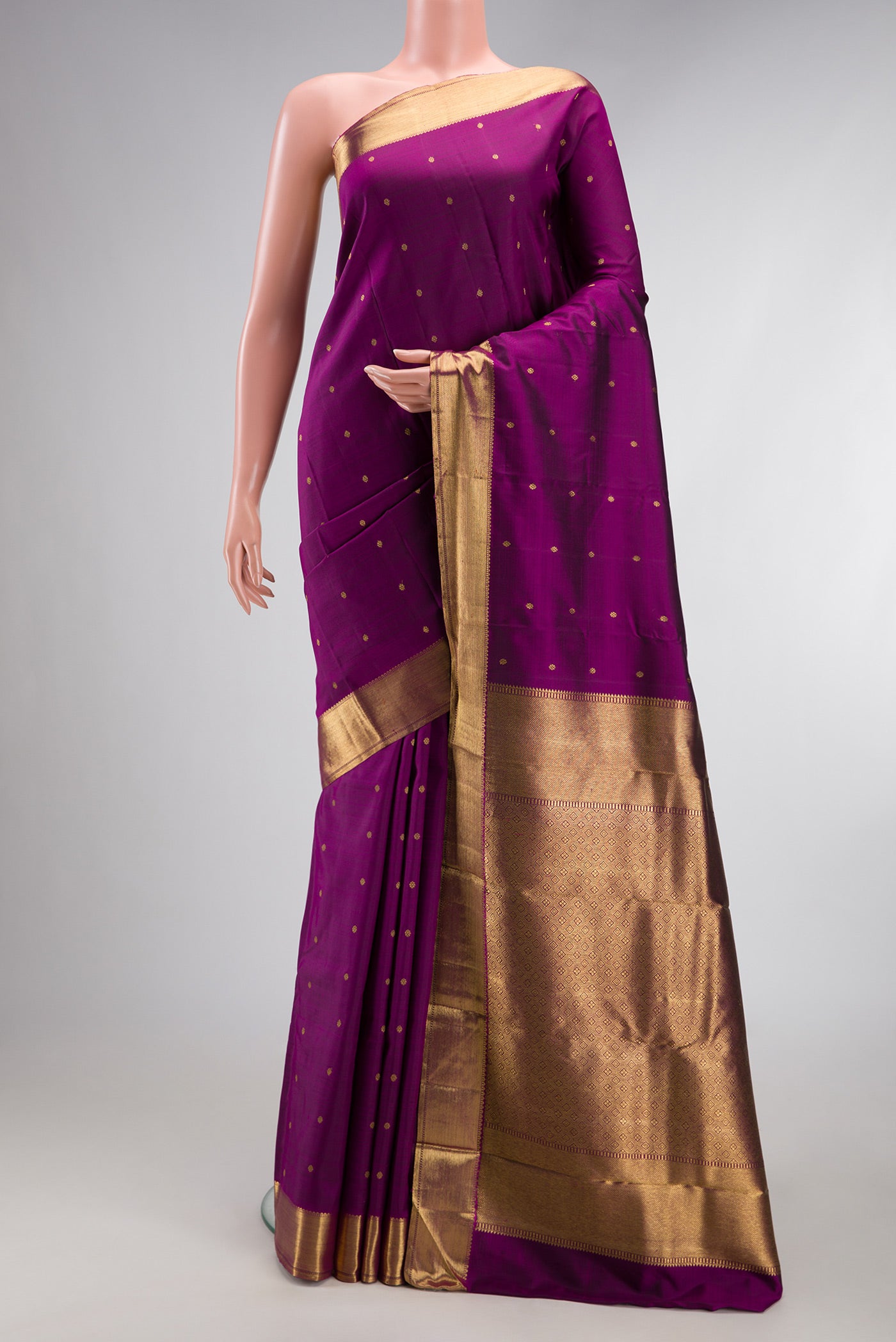 Pure Silk Pure Zari Purple Kanjivaram Saree with Zari Butta on the body and Zari Border.  displayed on a mannequin