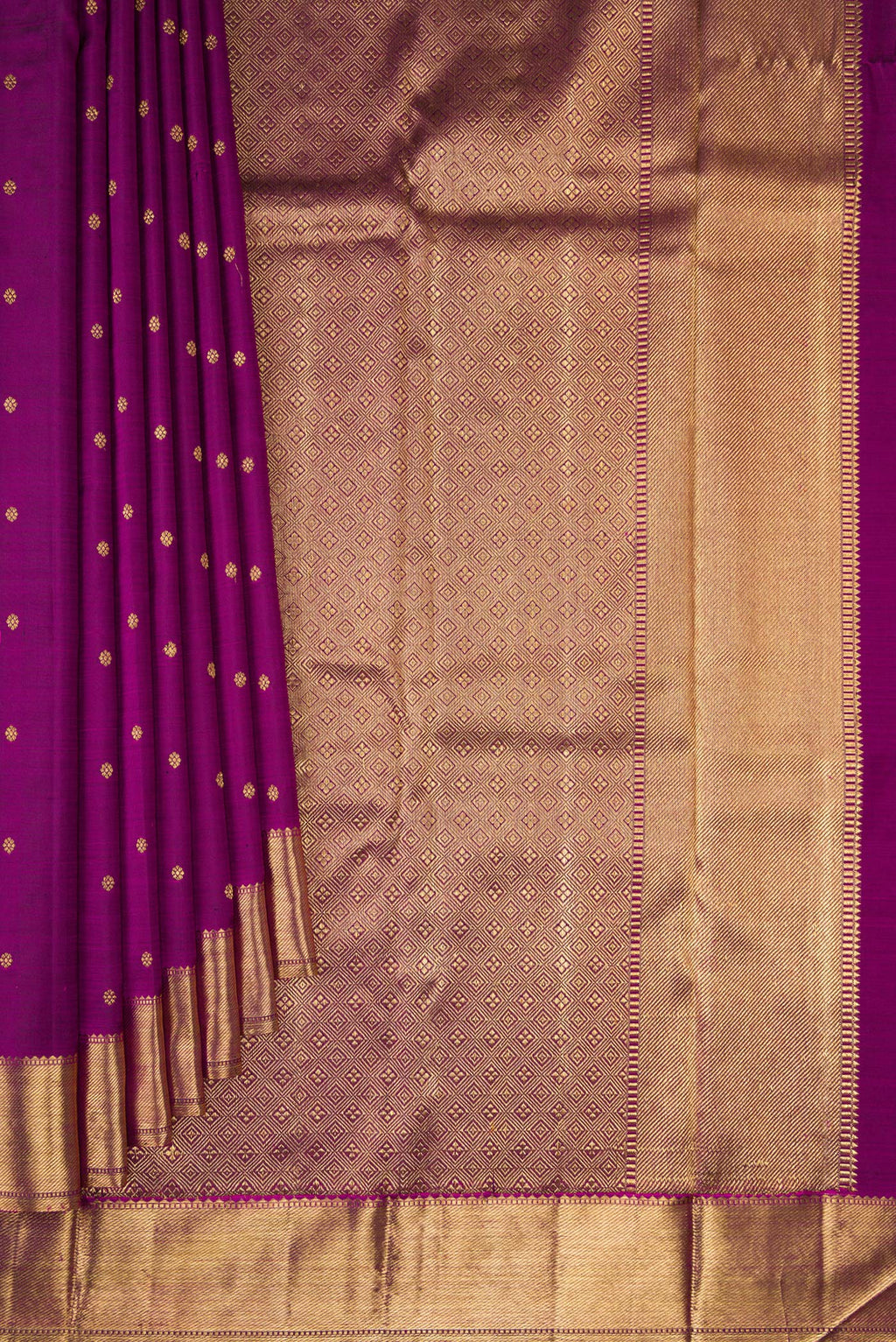 Pleats and pallu of Pure Silk Pure Zari Purple Kanjivaram Saree with Zari Butta on the body and Zari Border. 