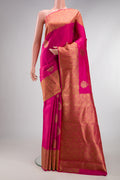 Pure Silk Pure Zari Pink Kanjivaram Saree with Zari Butta on the body and Zari Border.  displayed on a mannequin