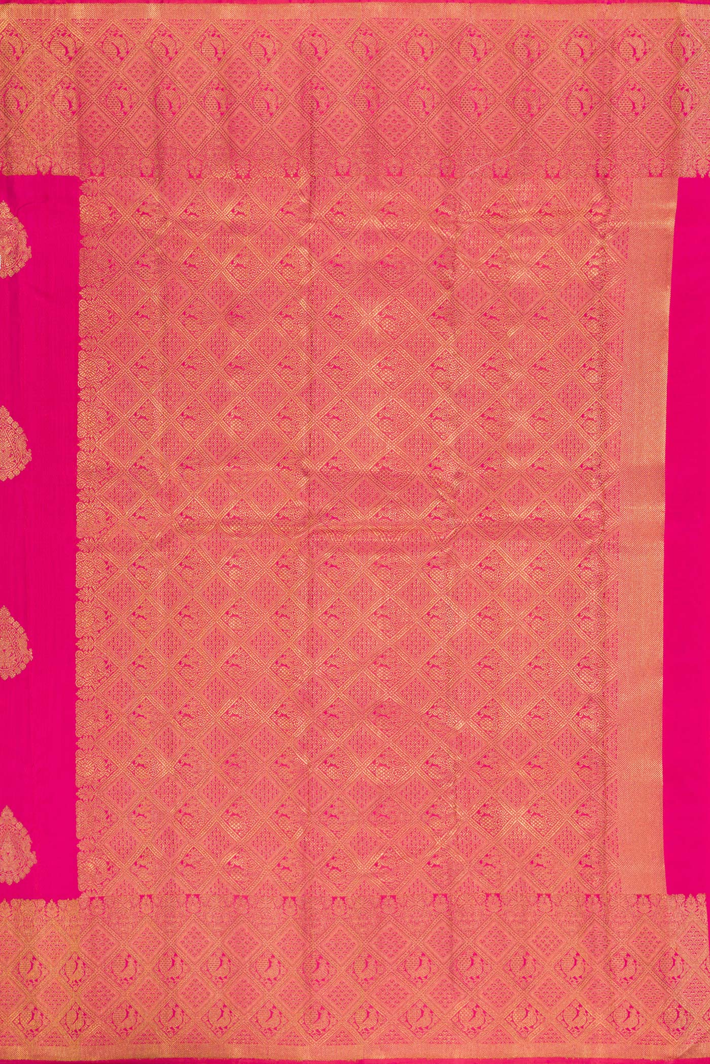 Close up image of the pallu of Pure Silk Pure Zari Pink Kanjivaram Saree with Zari Butta on the body and Zari Border. 
