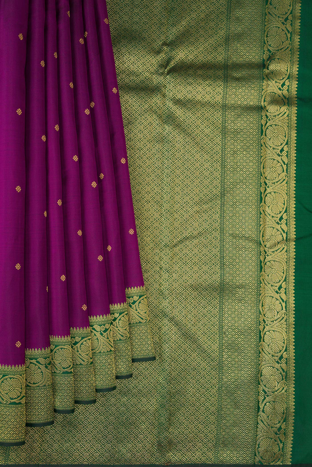 Pleats and pallu of Pure Silk Pure Zari Purple Kanjivaram Saree with Zari Butta on the body and Zari Border. 