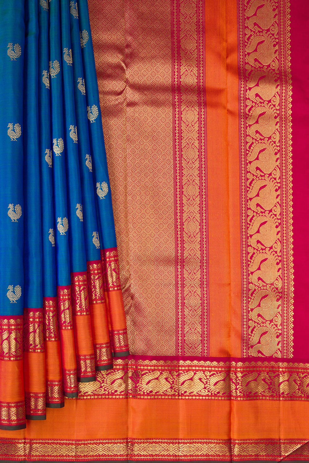 Pleats and pallu of Pure Silk Pure Zari Peacock Blue Kanjivaram Saree with Zari Butta on the body and Zari Border. 