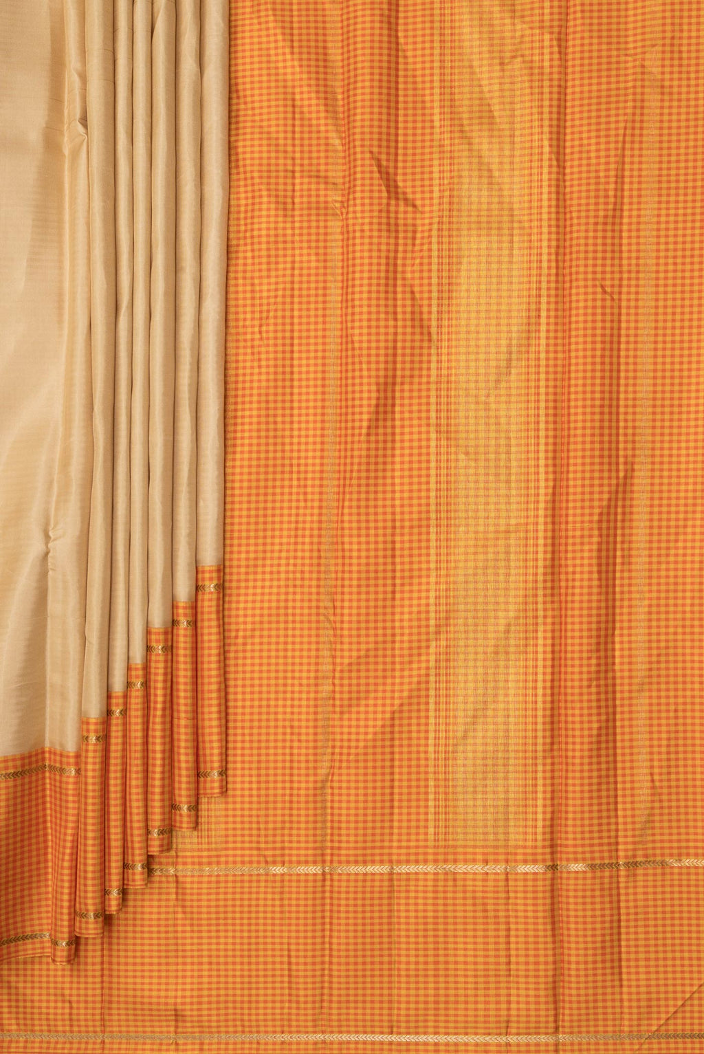 Pleats and pallu of Pure Silk Beige Dual Tone Kanjivaram Saree with Plain Body and Checks Border. 