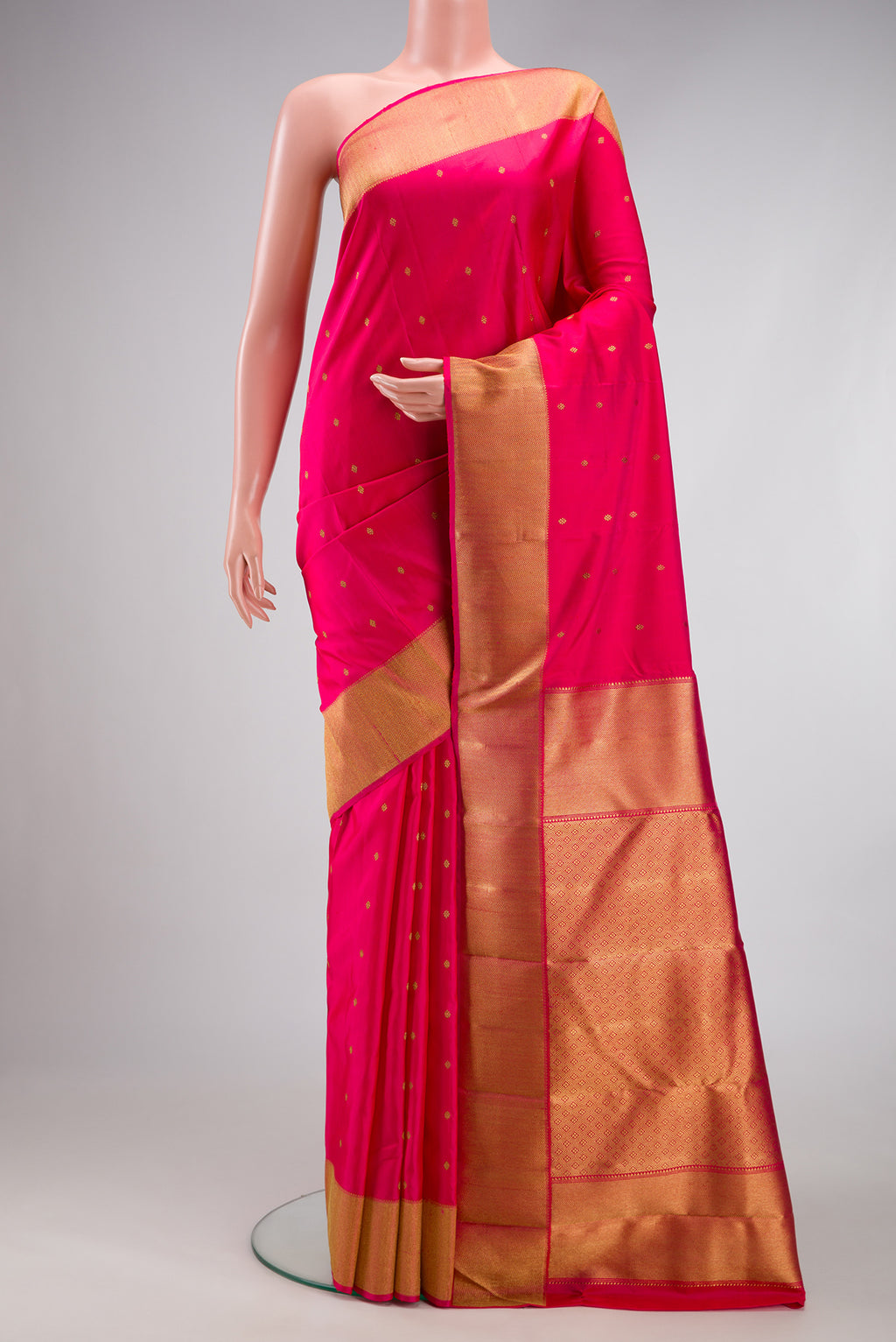 Pure Silk Pure Zari Dark Pink Kanjivaram Saree with Zari Butta on the body and Zari Border.  displayed on a mannequin