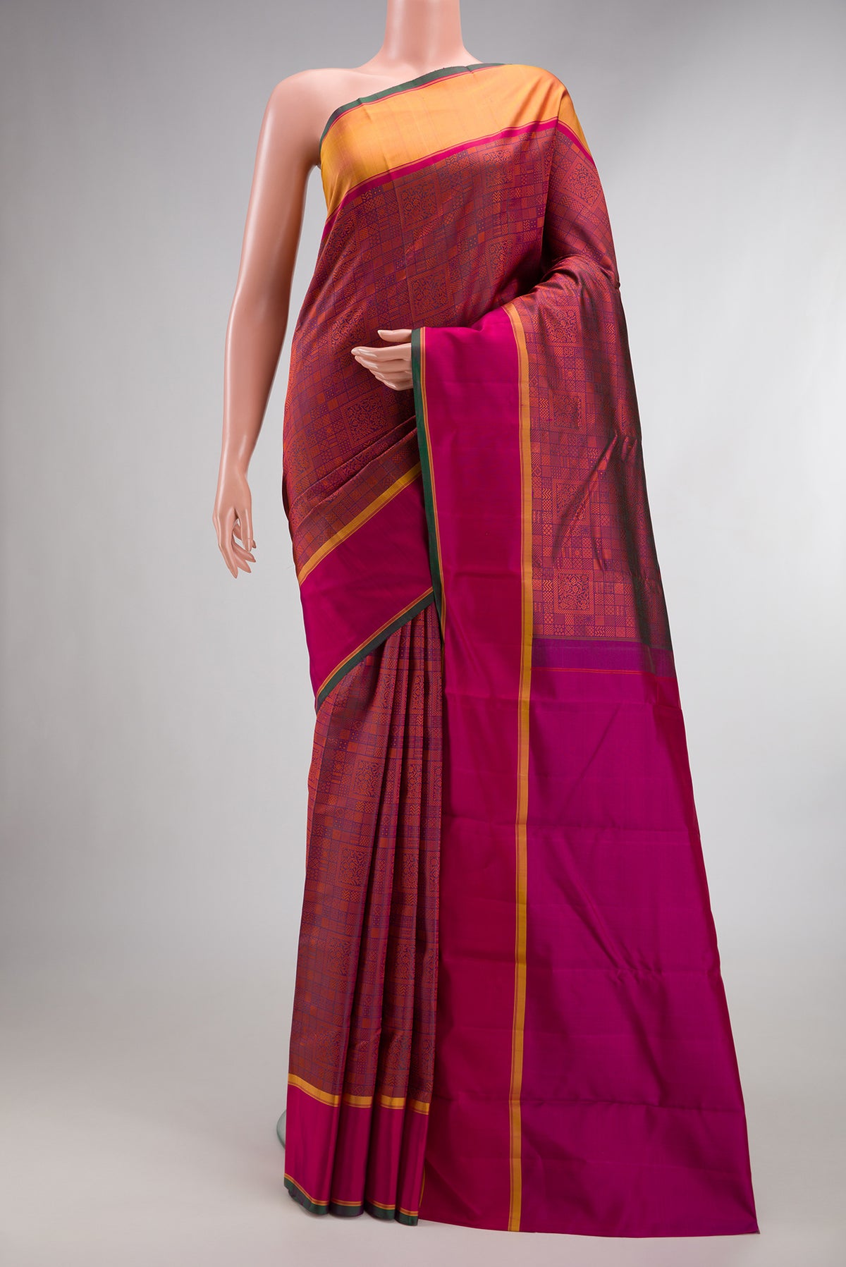Pure Silk Magenta Dual Tone Kanjivaram Saree with Jacquard design on the body and Ganga Jamuna Border.  displayed on a mannequin