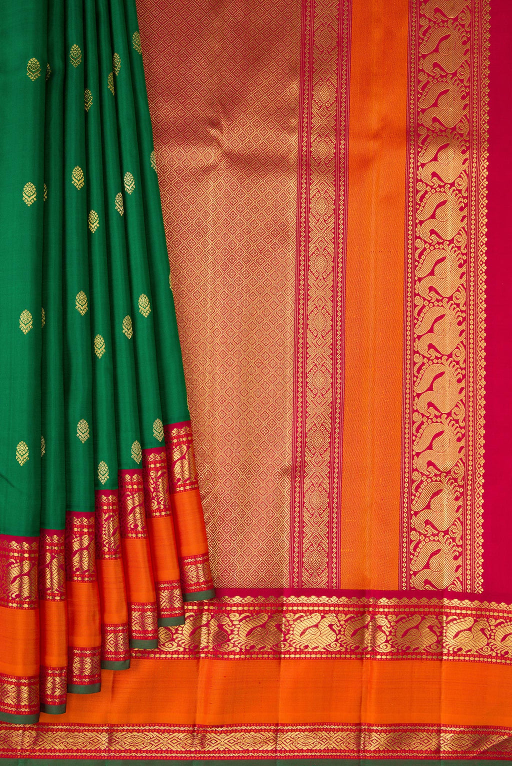 Pleats and pallu of Pure Silk Pure Zari Green Kanjivaram Saree with Zari Butta on the body and Zari Border. 