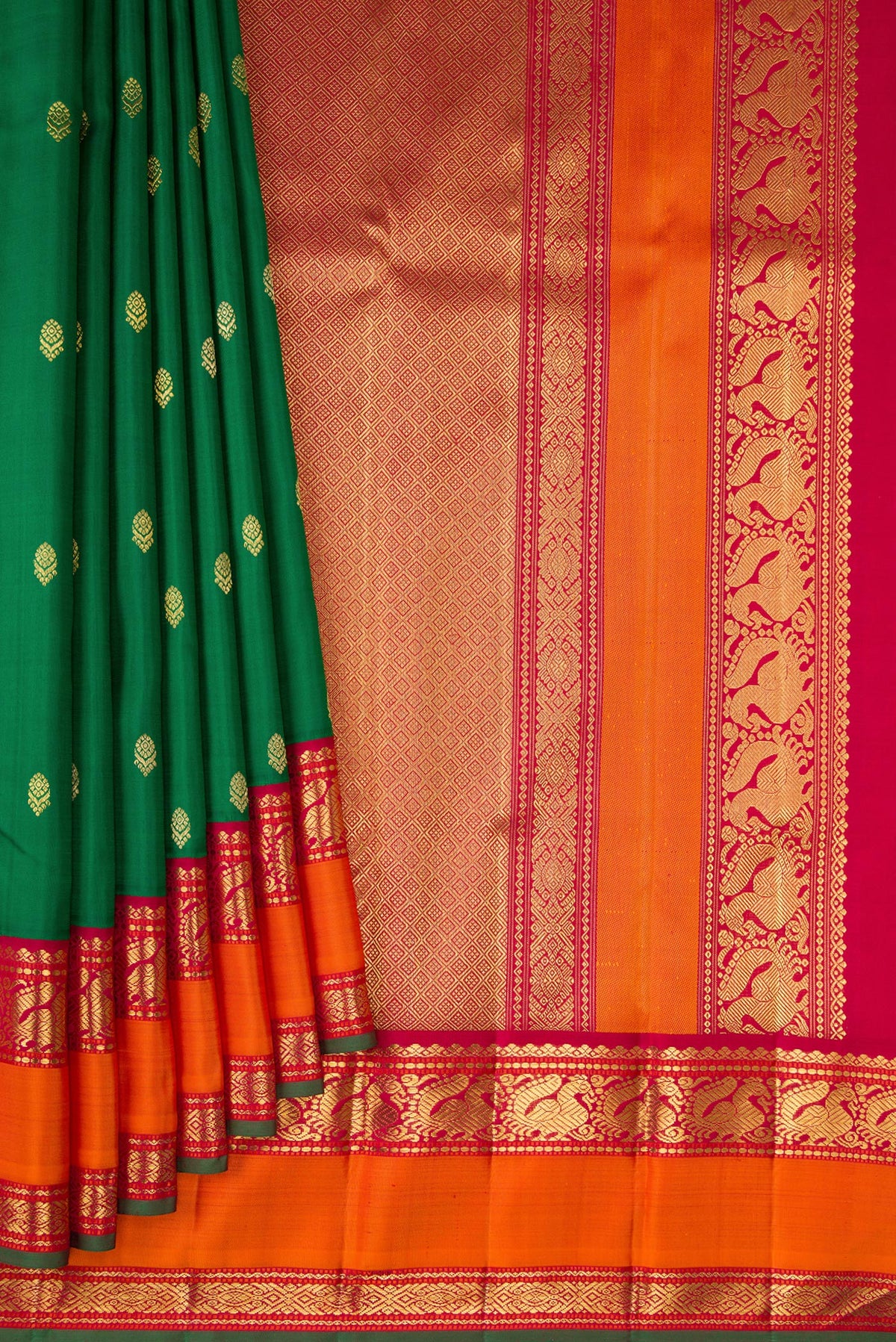 Pleats and pallu of Pure Silk Pure Zari Green Kanjivaram Saree with Zari Butta on the body and Zari Border. 