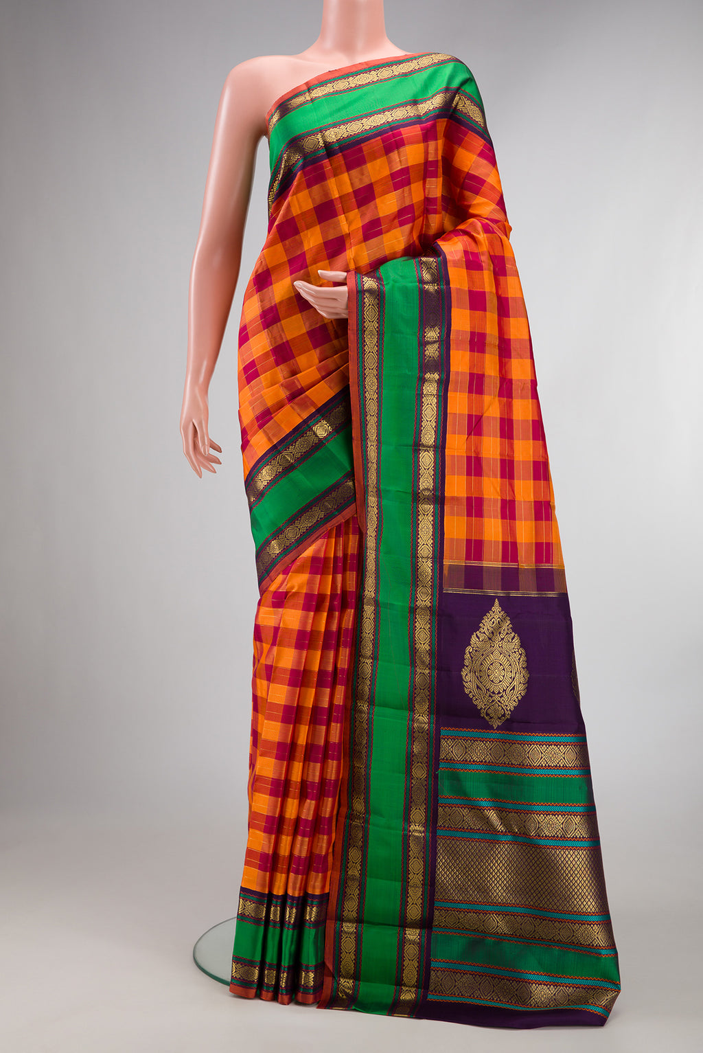Pure Silk Pure Zari Orange and Maroon Dual Tone Kanjivaram Saree with Checked design on the body and Zari Border.  displayed on a mannequin