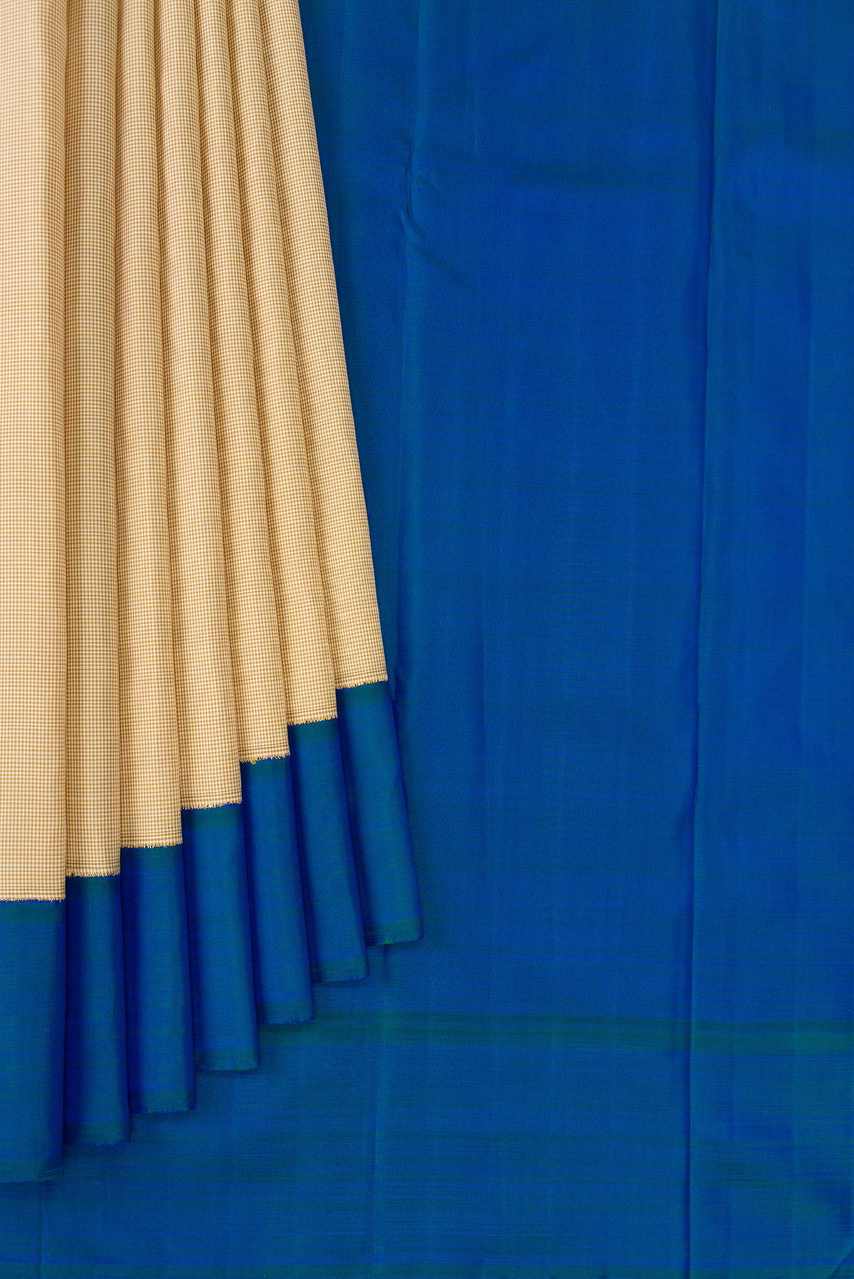 Pleats and pallu of Beige Kanjivaram Silk Saree with Checked design on the body and Plain Border. 