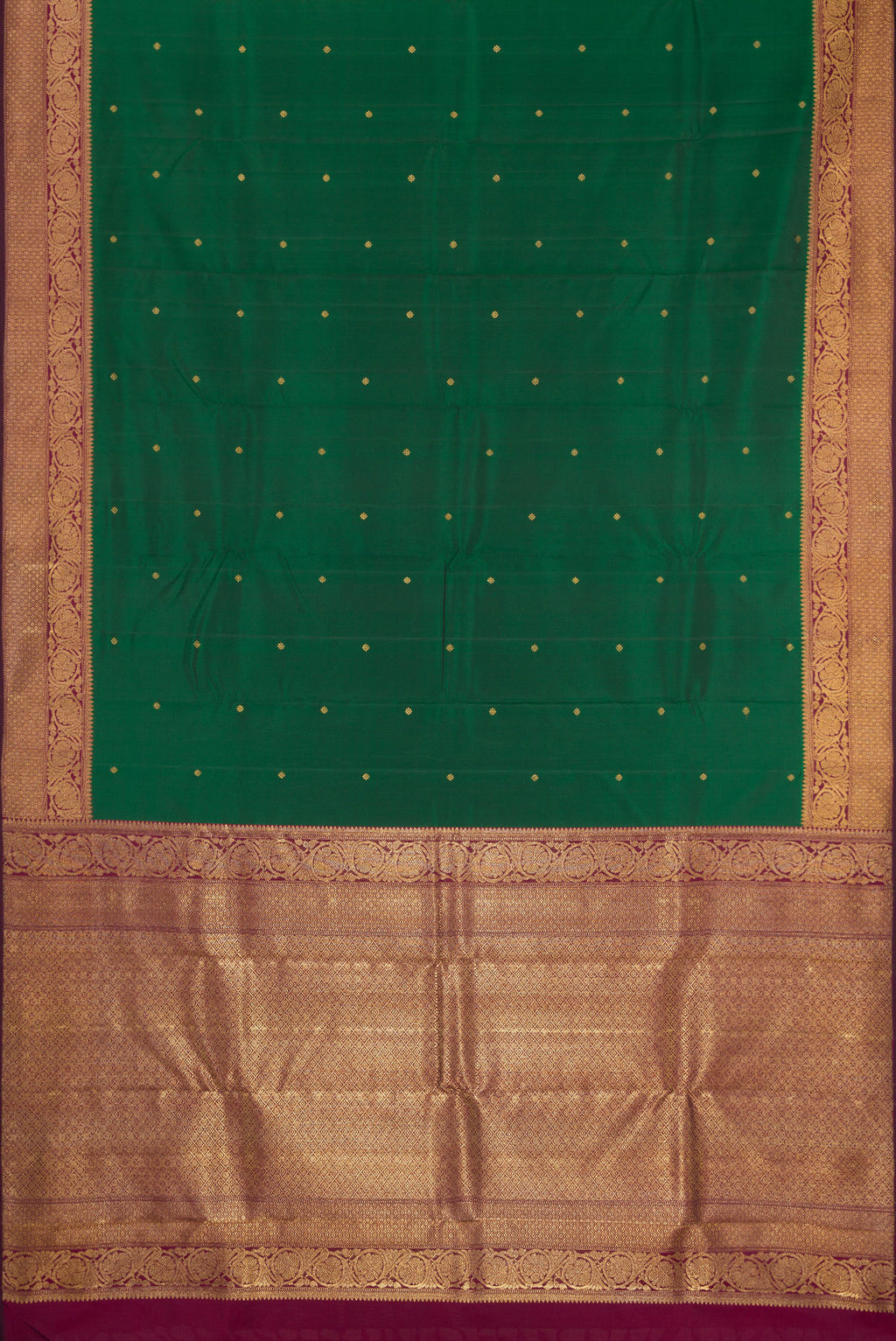 Flat view of Pure Silk Pure Zari Bottle Green Kanjivaram Saree with Zari Butta on the body and Fancy Border. 