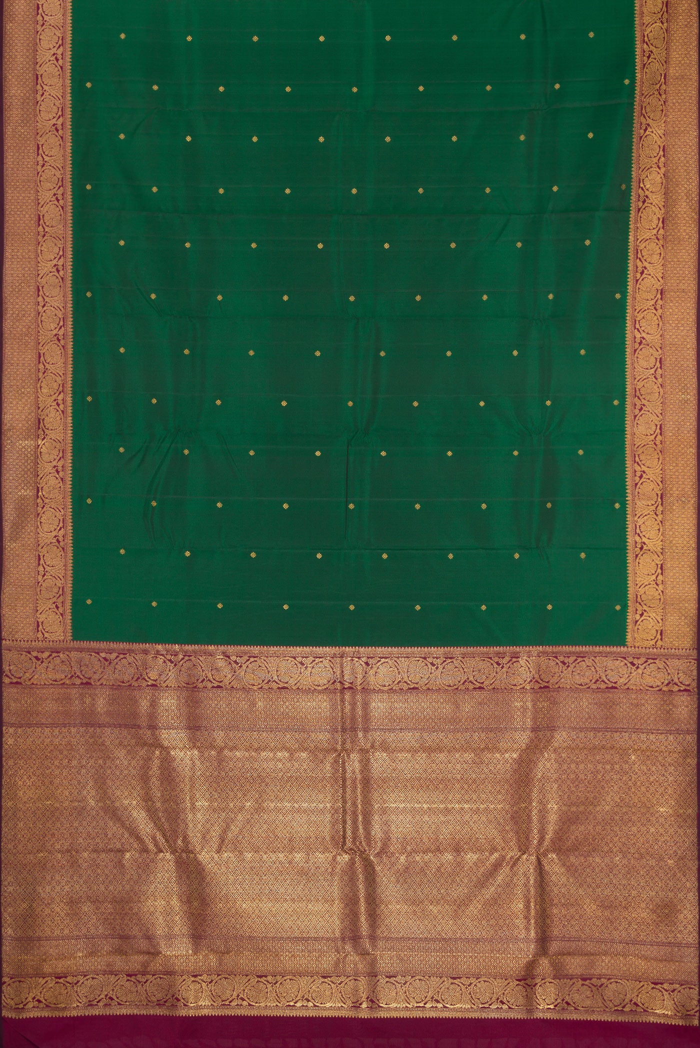 Flat view of Pure Silk Pure Zari Bottle Green Kanjivaram Saree with Zari Butta on the body and Fancy Border. 